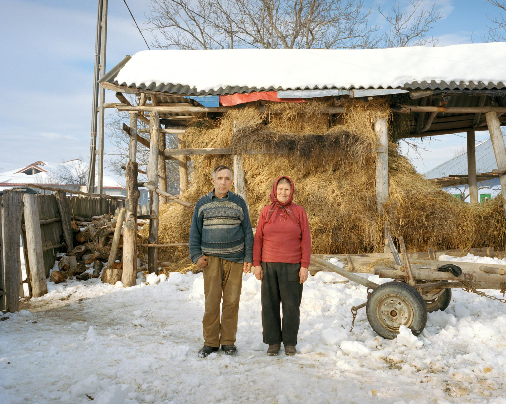 Paltinis, Romania. Ioan and Maria in the courtyard of their house. Paltinis is a village located in a peripheral area of Vaslui county and it is mostly inhabited by gypsies, whose lives strongly depend on agriculture and farming. In Paltinis, Chevron had planned to drill its second well for shale gas extraction of Romania. Yet, in February 2015, Chevron officially quit Romania due to “poor exploration results and prolonged protests by environmentalists”