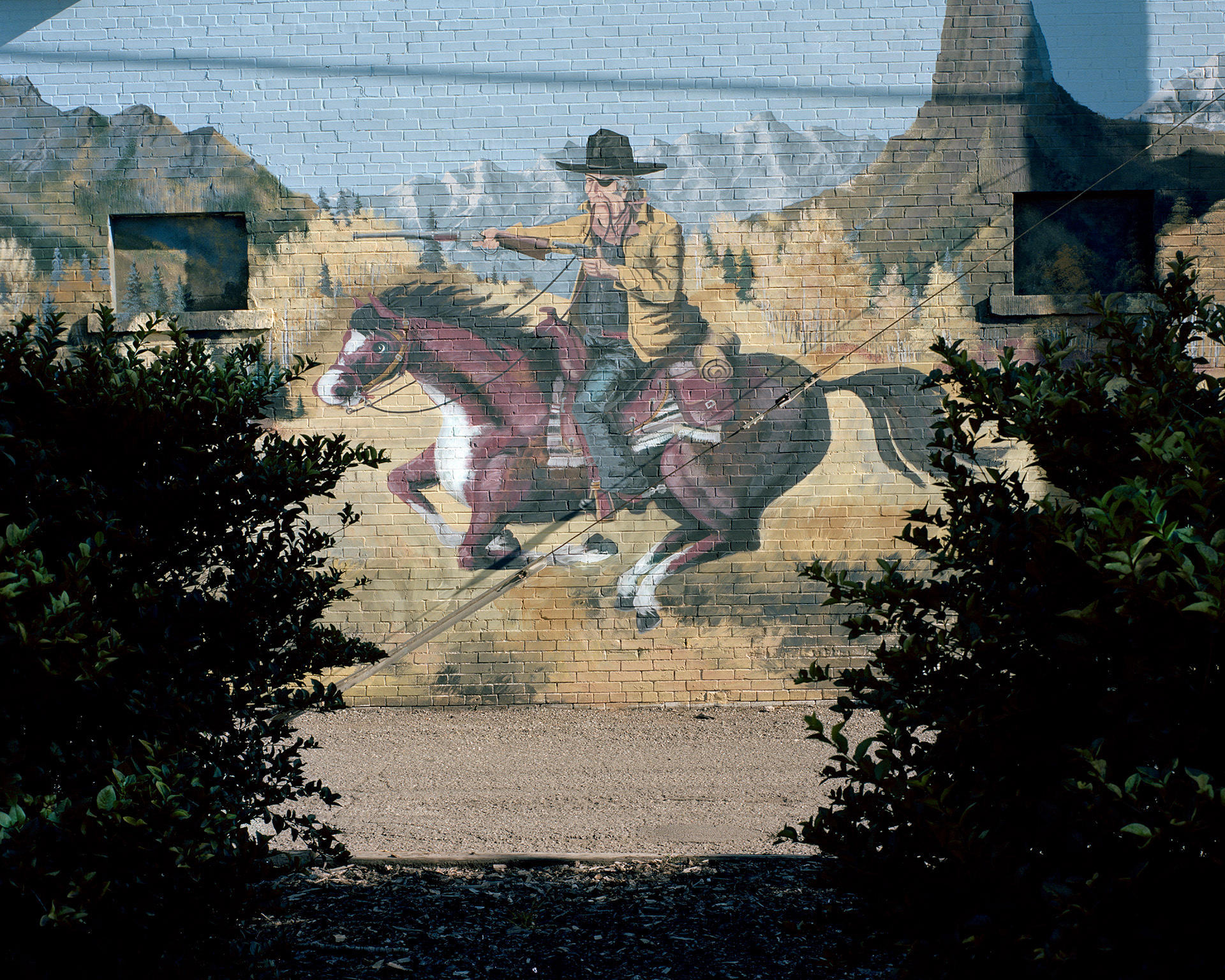 Montrose, Colorado, 2012. Graffiti portraying the final scene of the 1969 western movie True Grit. The film was entirely shot in Ouray and Montrose Counties. John Wayne won the only Academy Award of his long career for the role of Rooster Cogburn in this picture