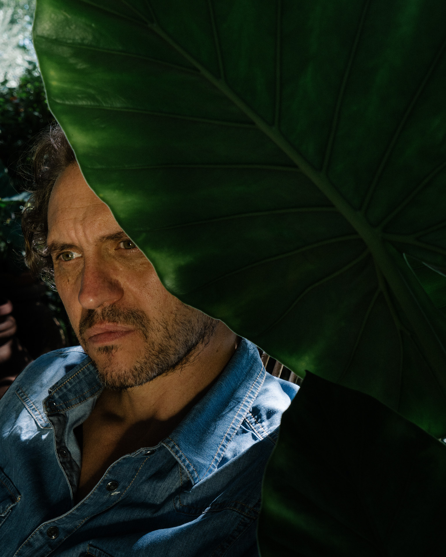 Tomas Ciampi, director and musician, posing in the garden of his house