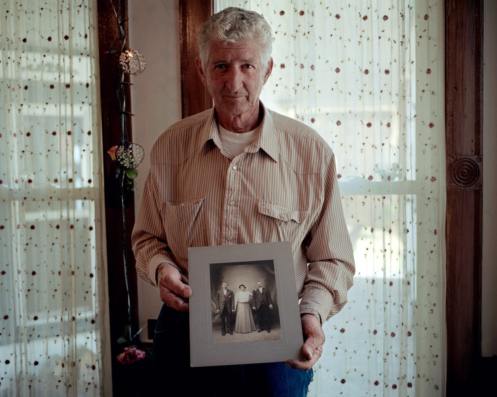 Silverton, Colorado. Frank Montonati shows an old photograph of his ancestors, moved from northern Italy to Colorado in 1870. Frank is a mining engineer and since 1966 he has worked in mining camps all over the world. Today he coordinates the operations in his own gold mine in Silverton together with his son