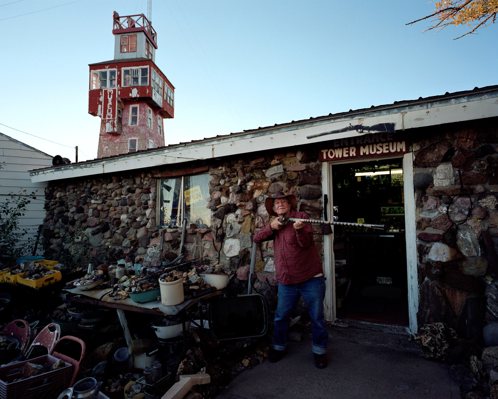 Genoa, Colorado, 2012. Jerry Chubbuck, a retired sheriff, is the caretaker of the Wonder Tower in Genoa. In the building have been stored thousands of oddities and other bizarre items found by Jerry himself during 60 years of quests in the West. Before the abandonment of the town, the Wonder Tower used to host a restaurant, now partially converted into Jerry's house