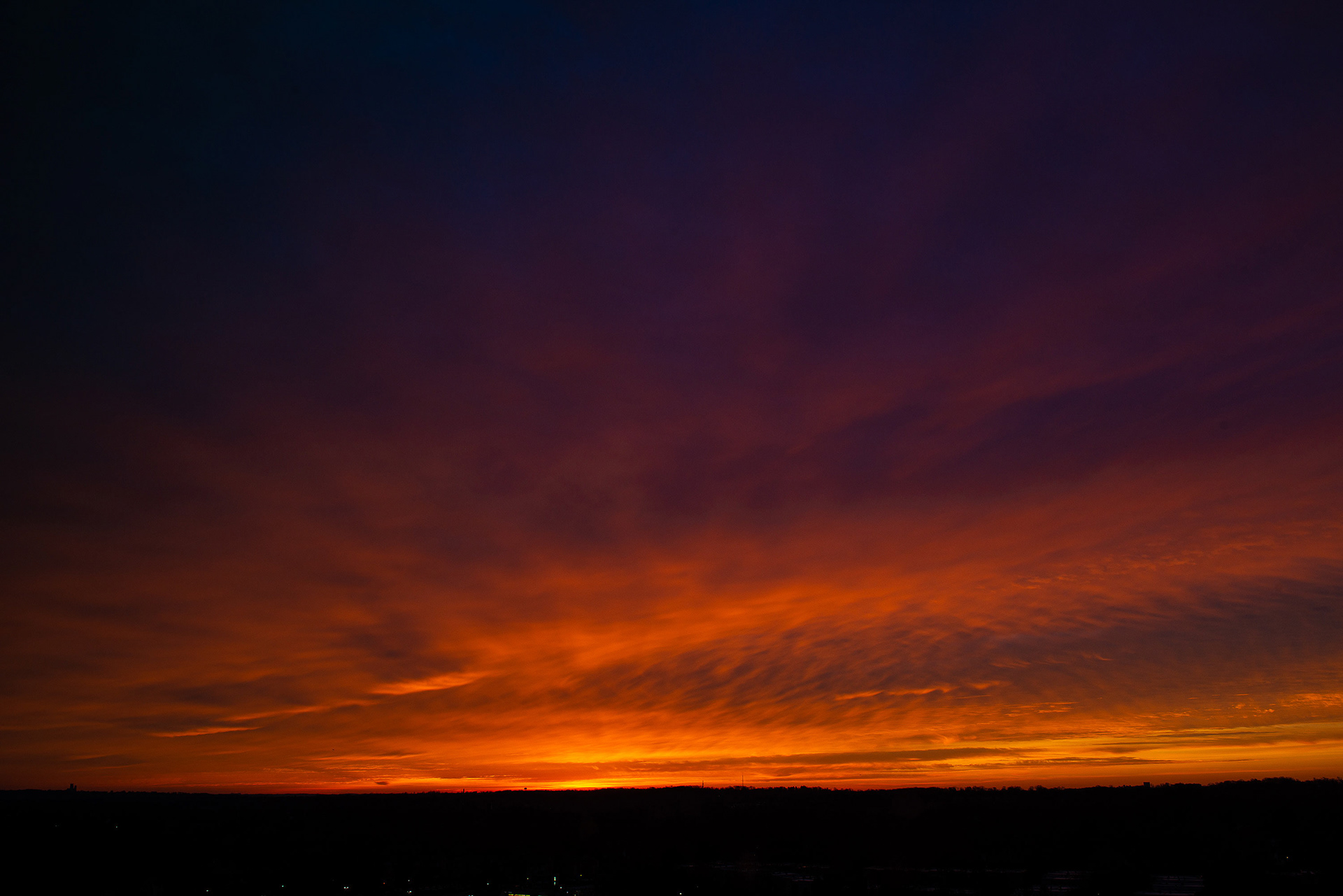 For years I've been struggling to classify this cloud phenomena that looked like everything being pulled towards a single area. If I squint a little bit it reminds me vaguely of a cavum (aka a fallstreak hole) where a chain reaction of freezing is set off in one portion of a cloud layer and a hole forms in the layer as all of the moisture starts to get pulled away and fall below. But that phenomena usually produces a hole in the layer with crisper edges than this. And usually it produces an area in the middle that looks more streaky, like virga.