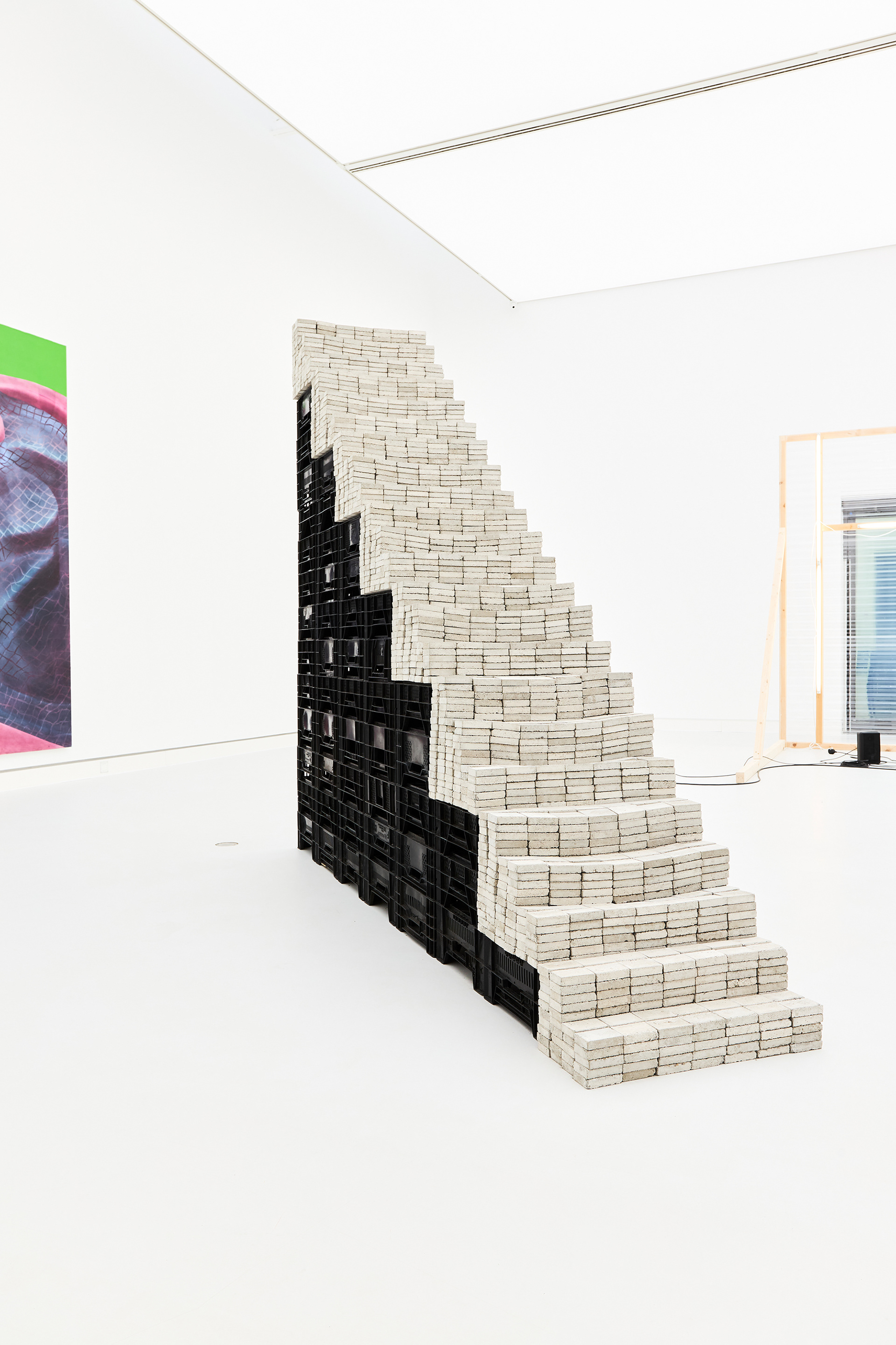 Potemkin, 2020, installation featuring a staircase made of concrete blocks and vegetable crates.