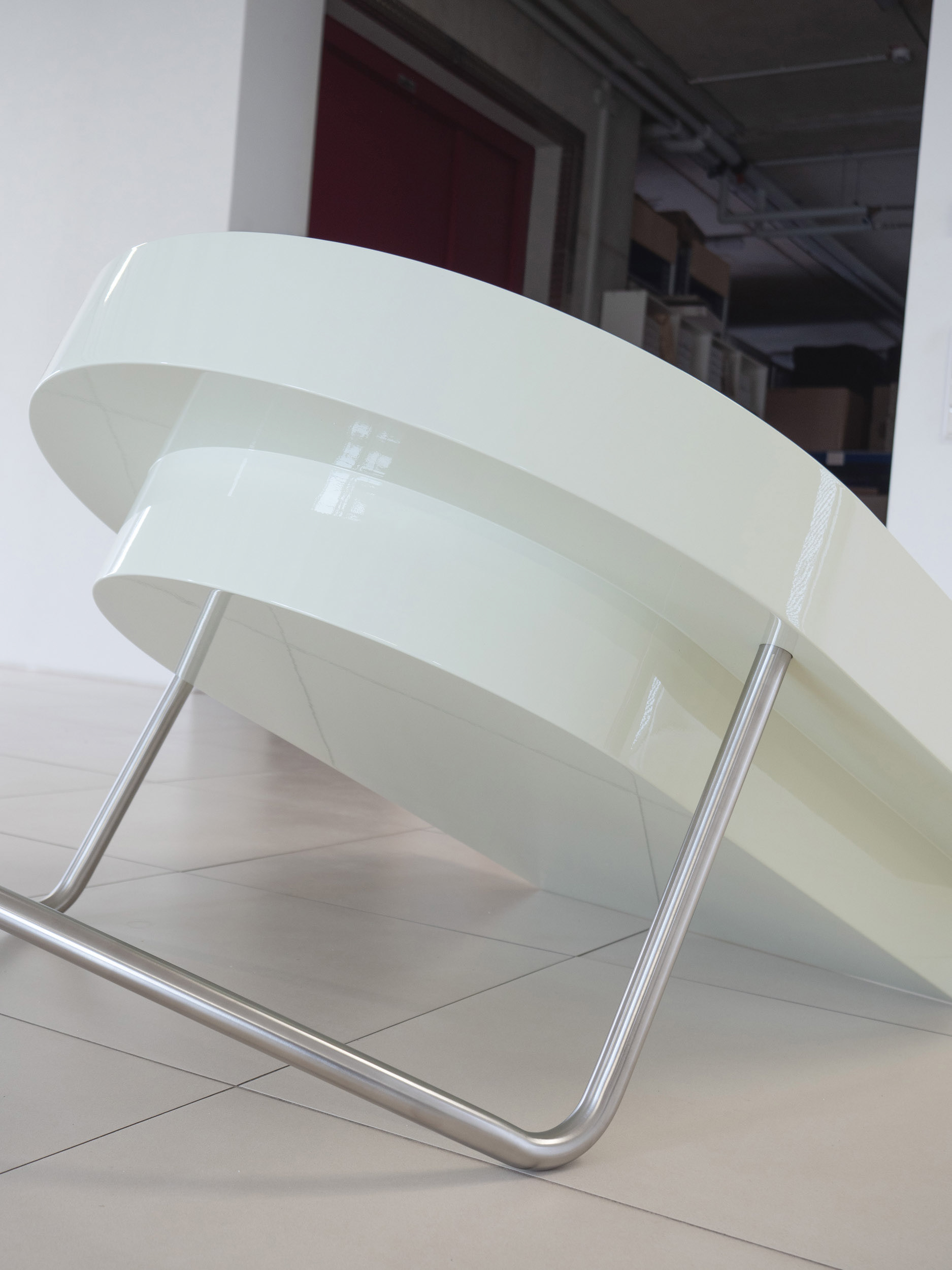 Jaune Vanille, 2026, sculptural work made of high-gloss painted MDF and stainless steel.