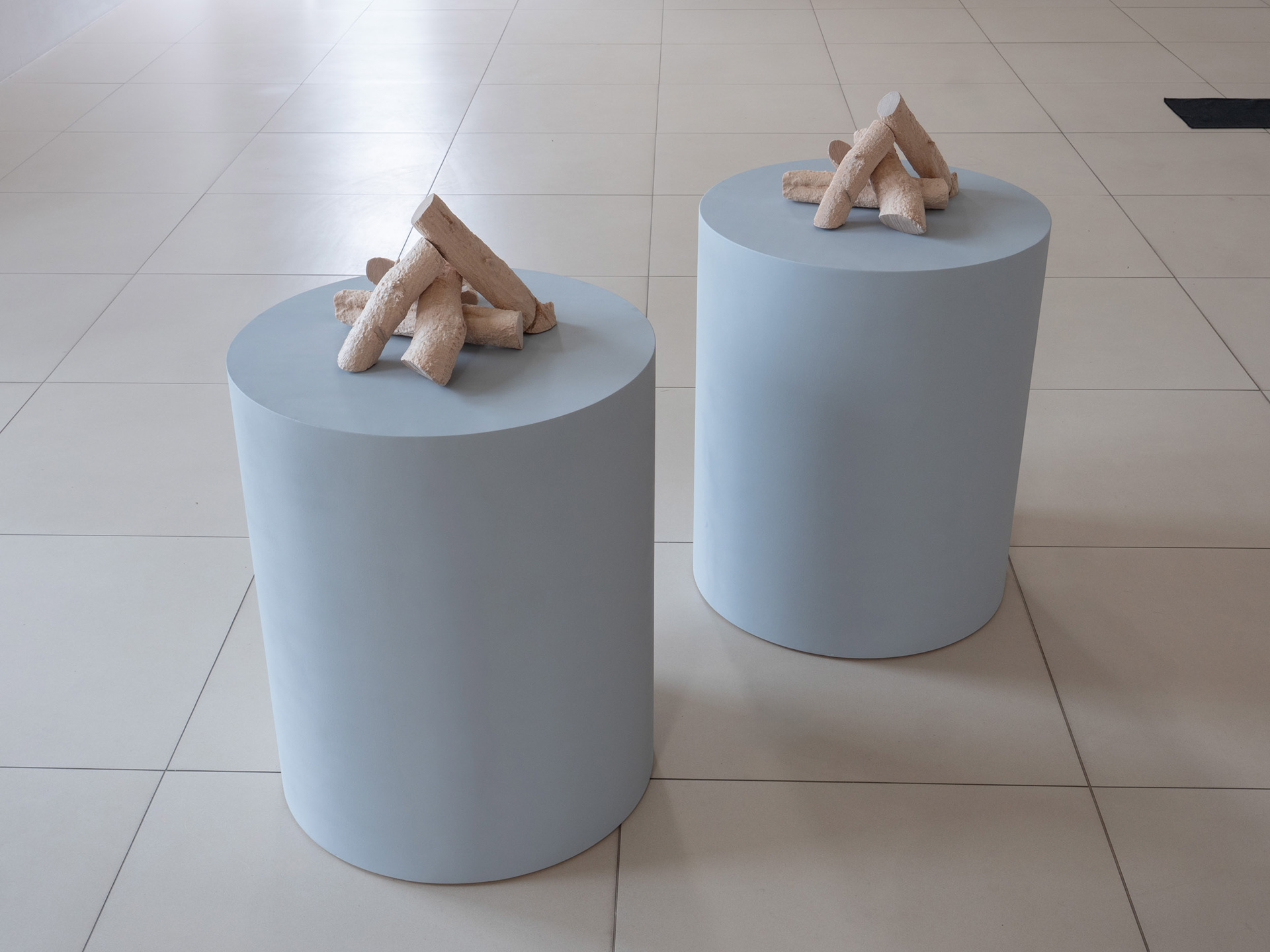 FeuerFeuer, 2026, pair of sculptures made of spruce wood, poplar wood and MDF.