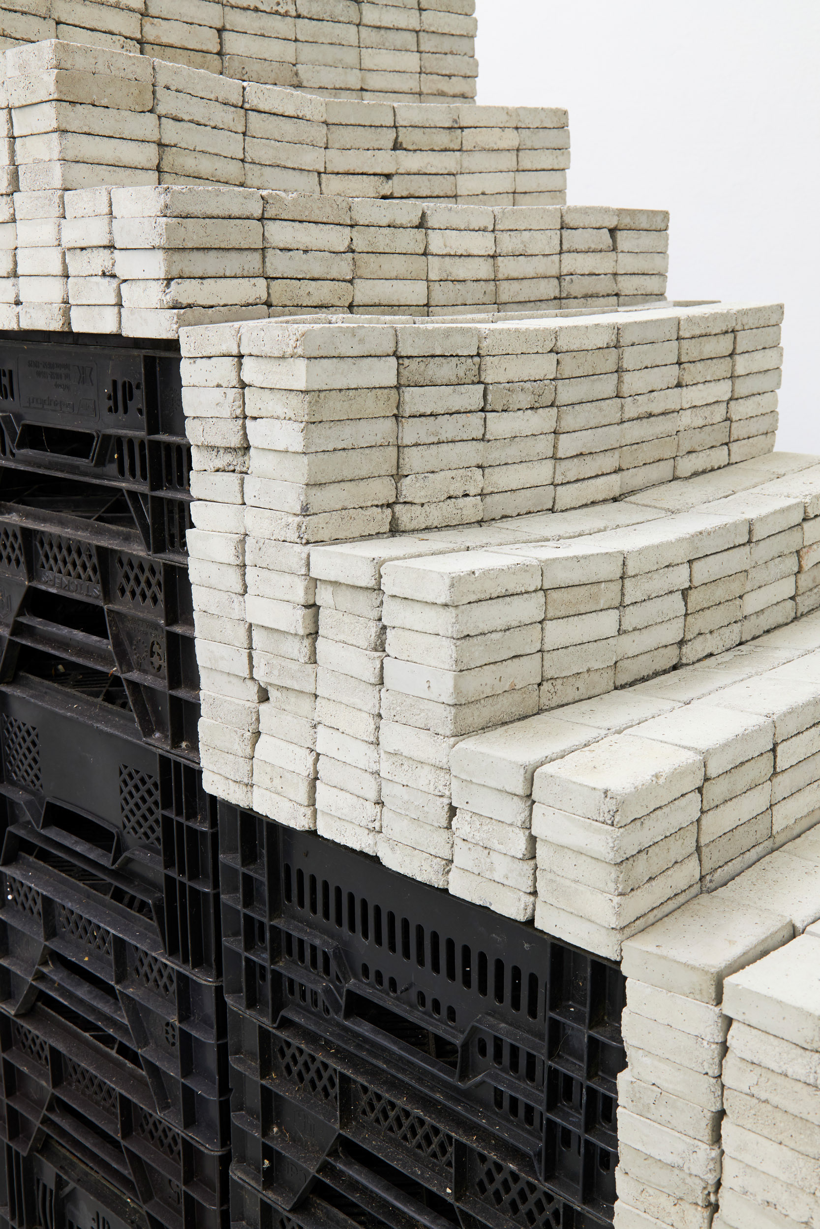 Potemkin, 2020, installation featuring a staircase made of concrete blocks and vegetable crates.