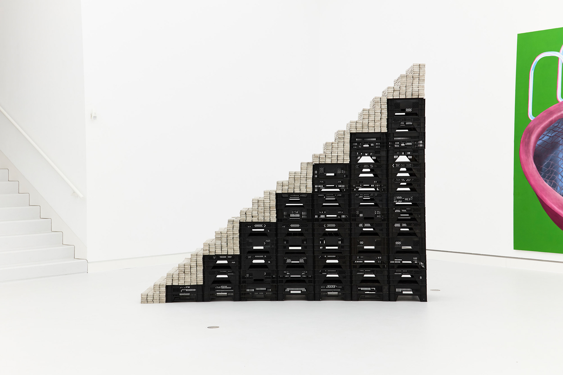 Potemkin, 2020, installation featuring a staircase made of concrete blocks and vegetable crates.