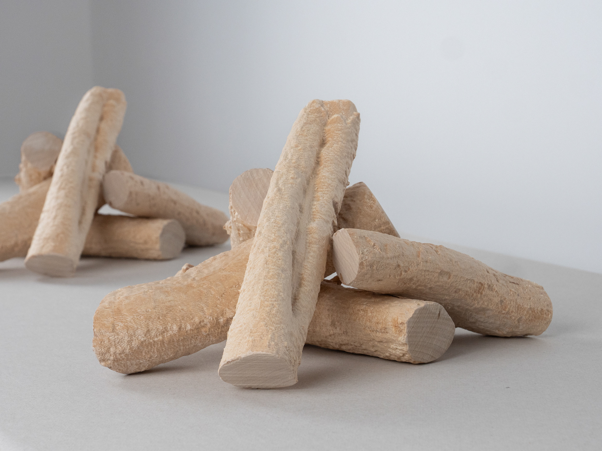 FeuerFeuer, 2026, pair of sculptures made of spruce wood, poplar wood and MDF.