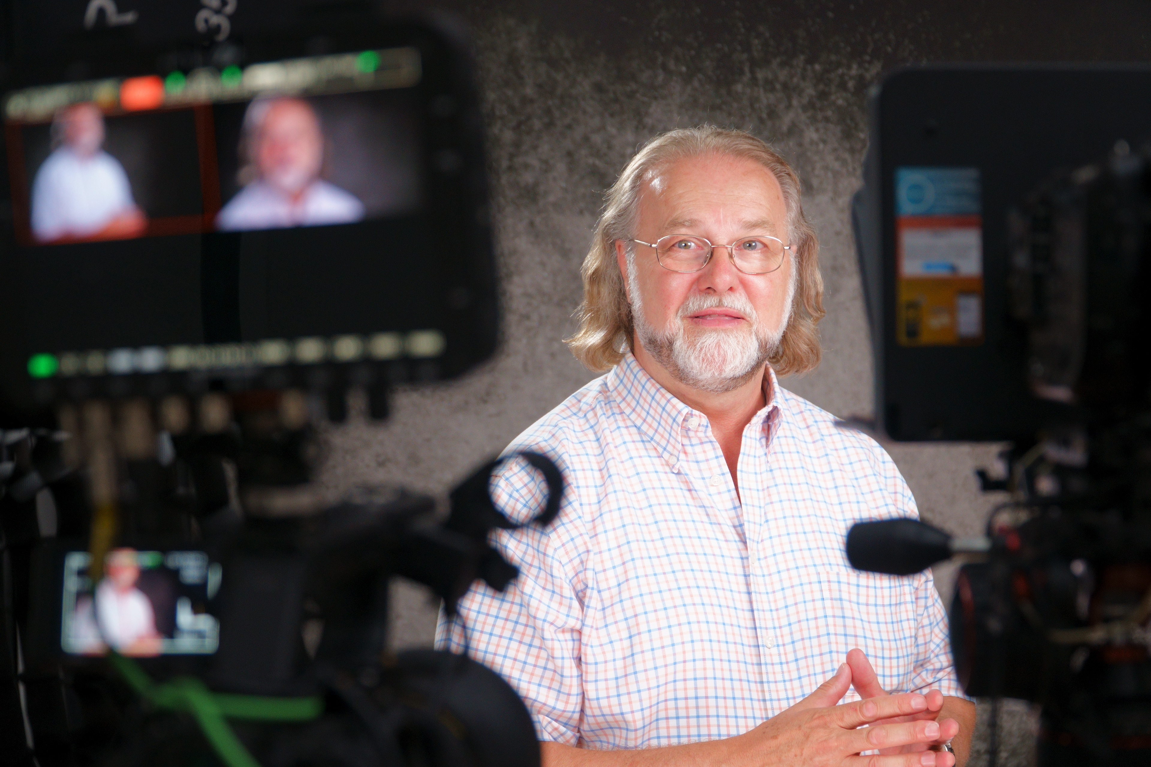 Teleprompter. Director monitor up to four cameras recording.