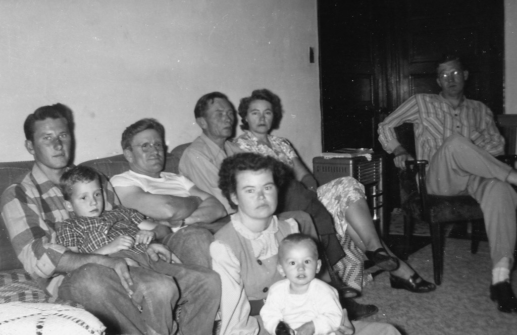 Norm Wells, Mike Griggs (on lap), Buck Henderson, Homer Garrett, Jessie Garrett (Patterson), Norm Wells Sr (F) unknown, Dan Wells