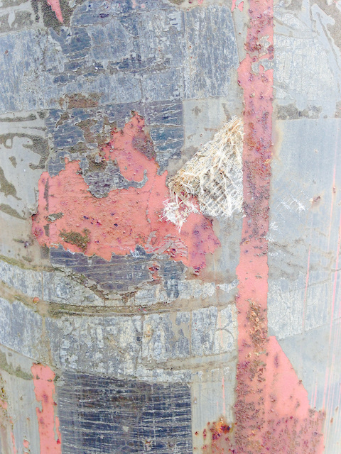 year of posters stuck to a telephone post