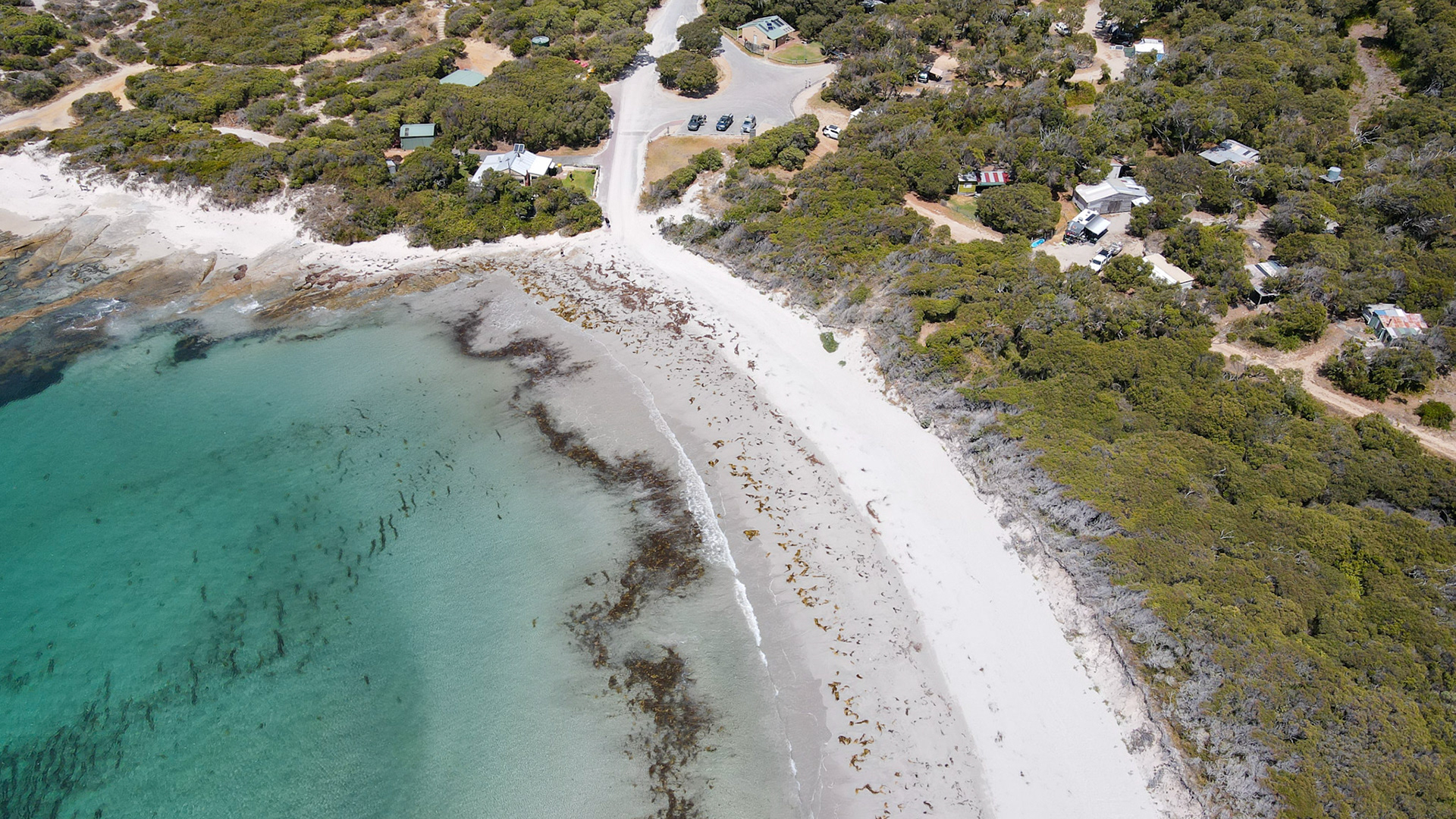 Experience the beauty of a serene beach where the ocean meets nature. Enjoy a peaceful escape to this idyllic coastal landscape.