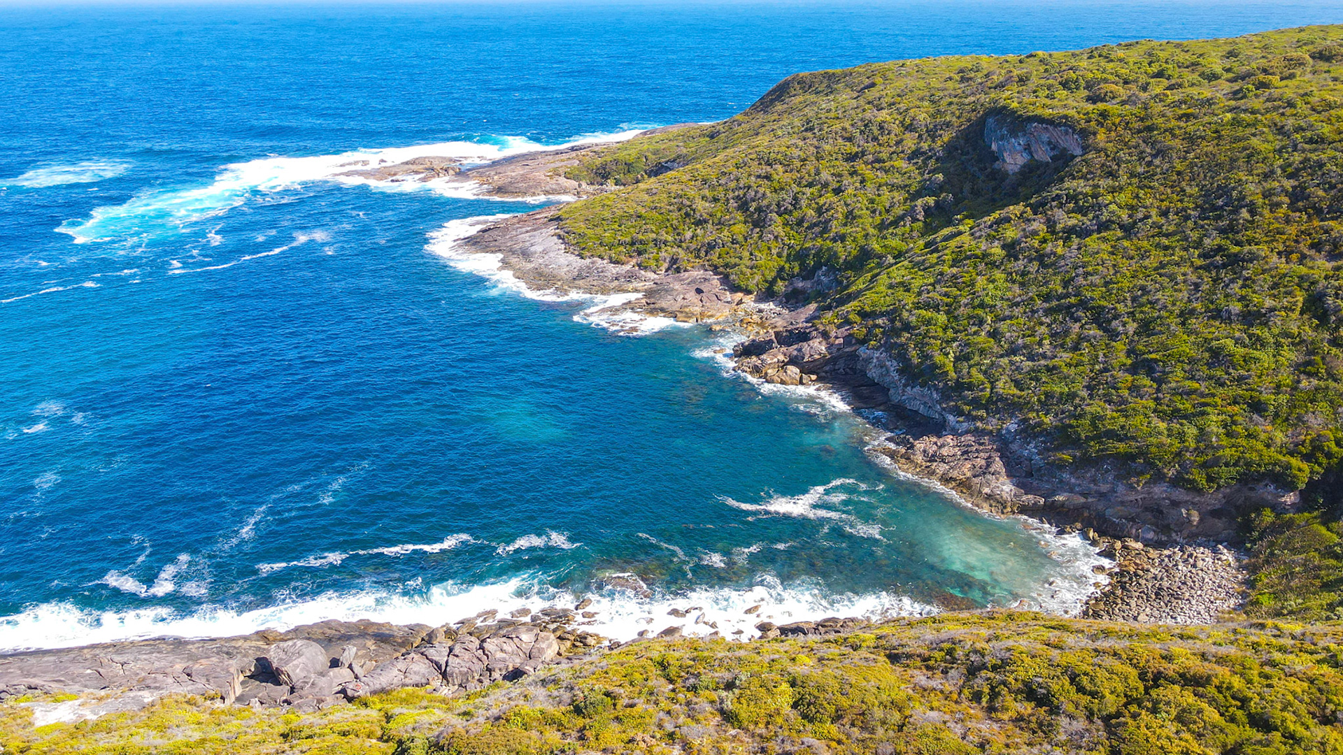 Discover the beauty of the ocean coastline, where waves crash against rocks, showcasing the power of nature and serene landscapes.