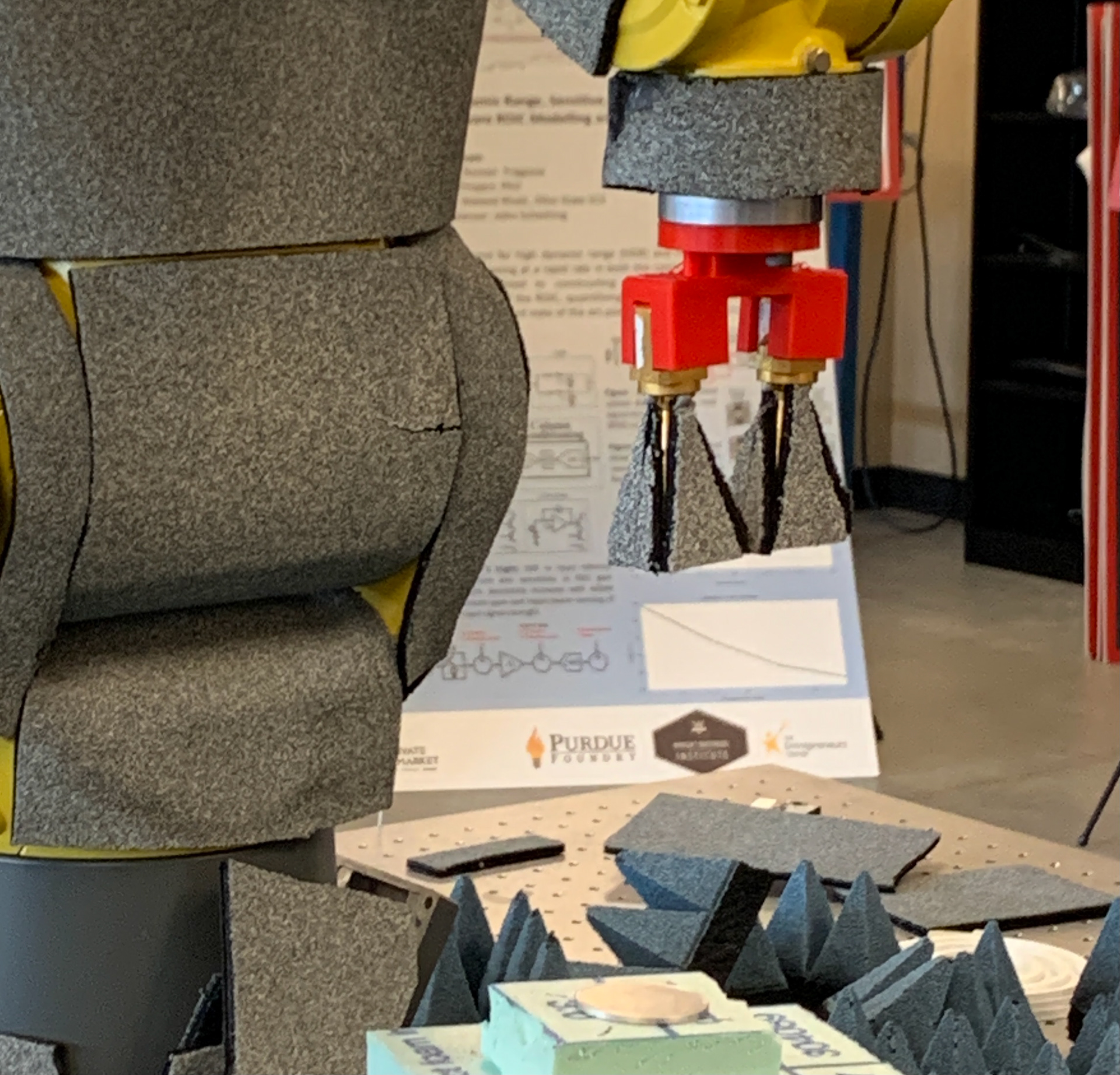 Antenna holder installed on FANUC robot performing testing