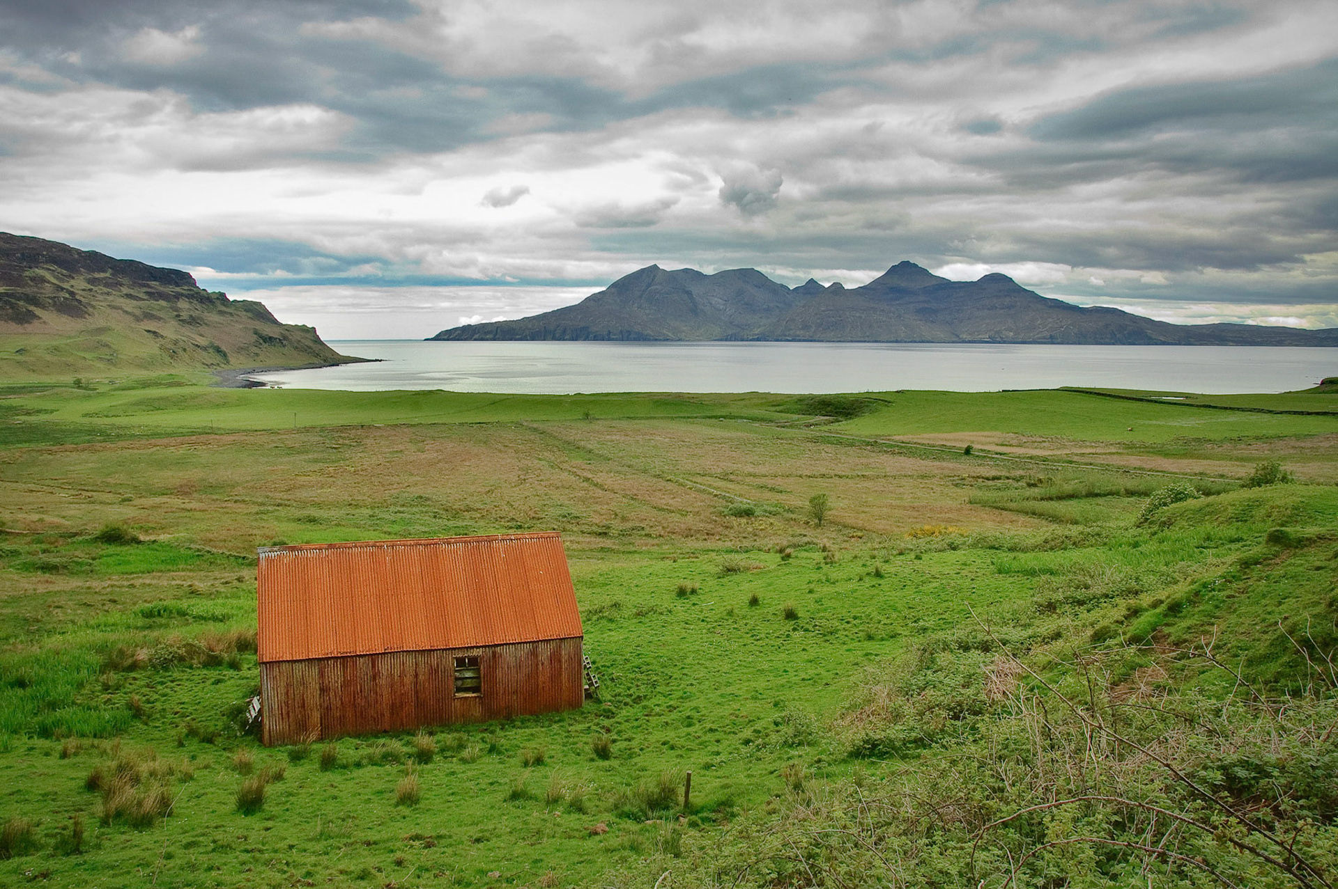 Isle of Eigg with the Isle of Rum in the backgound.