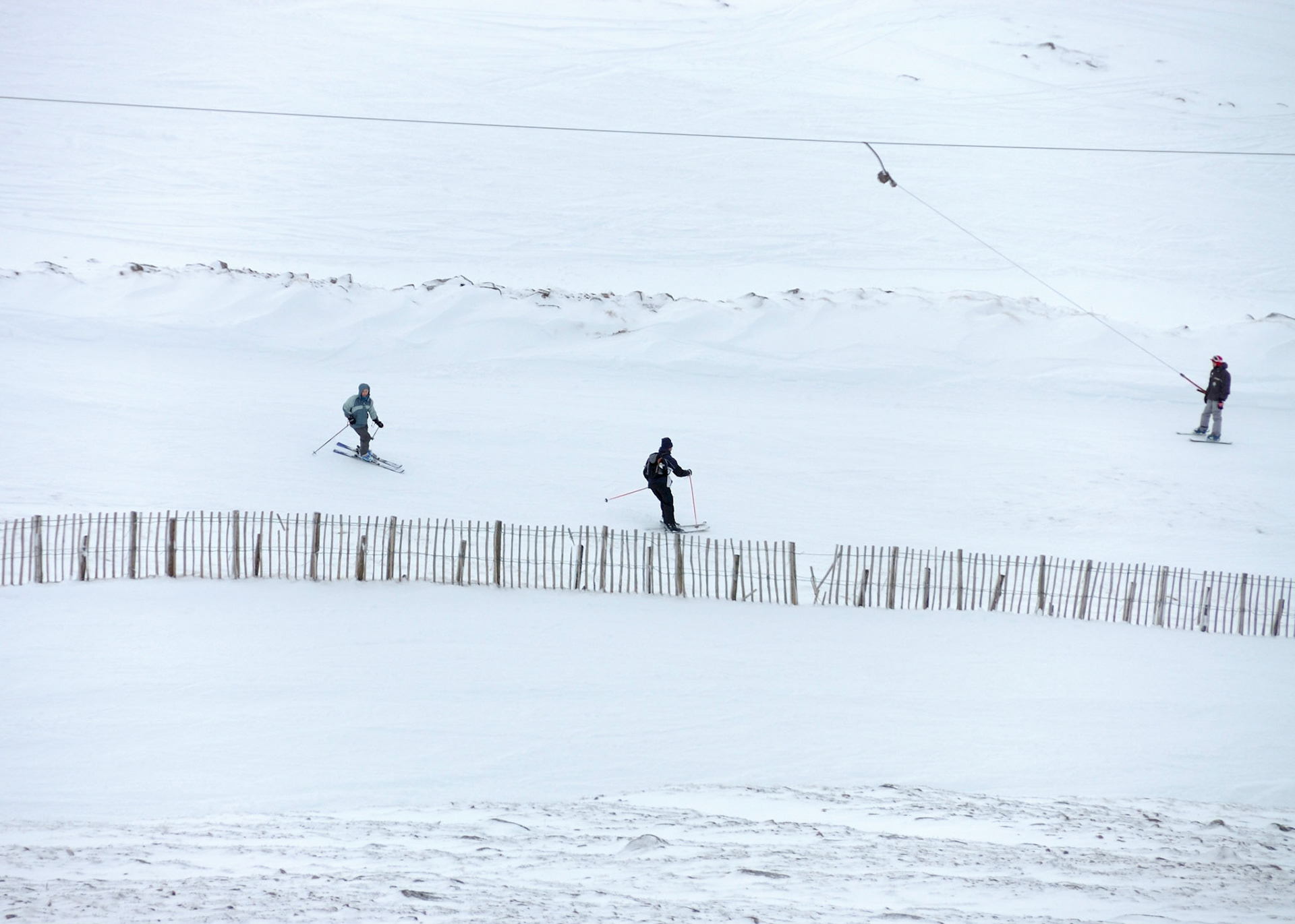 Jen and Peter skiing down
