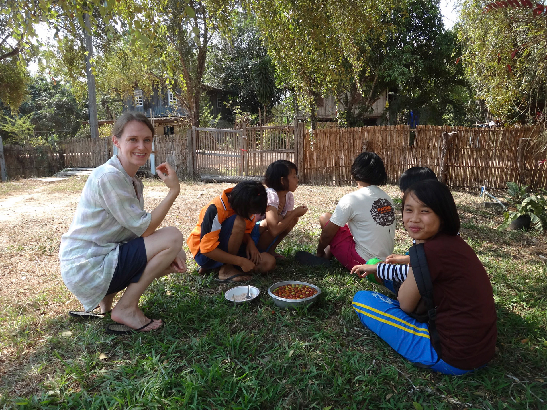 Local children eating Putsa (Jungle Plums) from the tree in our garden