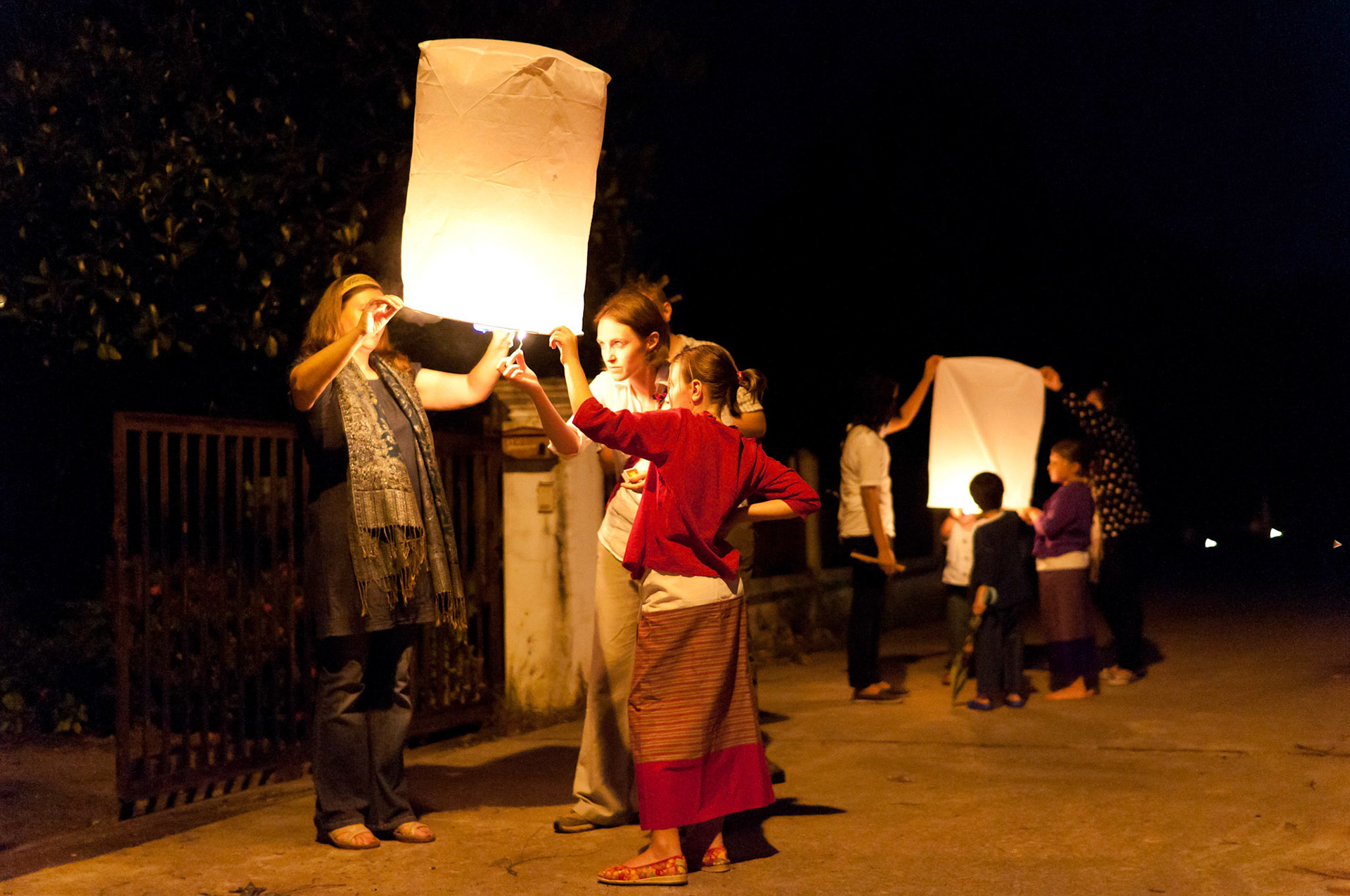 Launching sky lanterns during the Loy Krathong fesitval