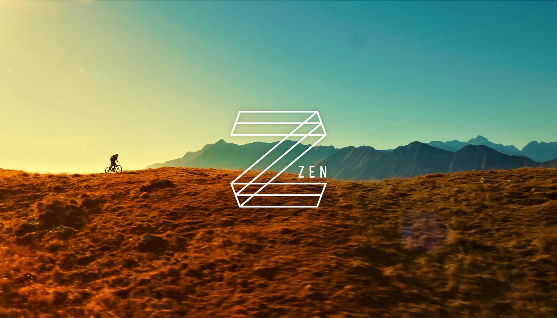 Image of a mountain biker riding in the mountains with Zen logo overlaid