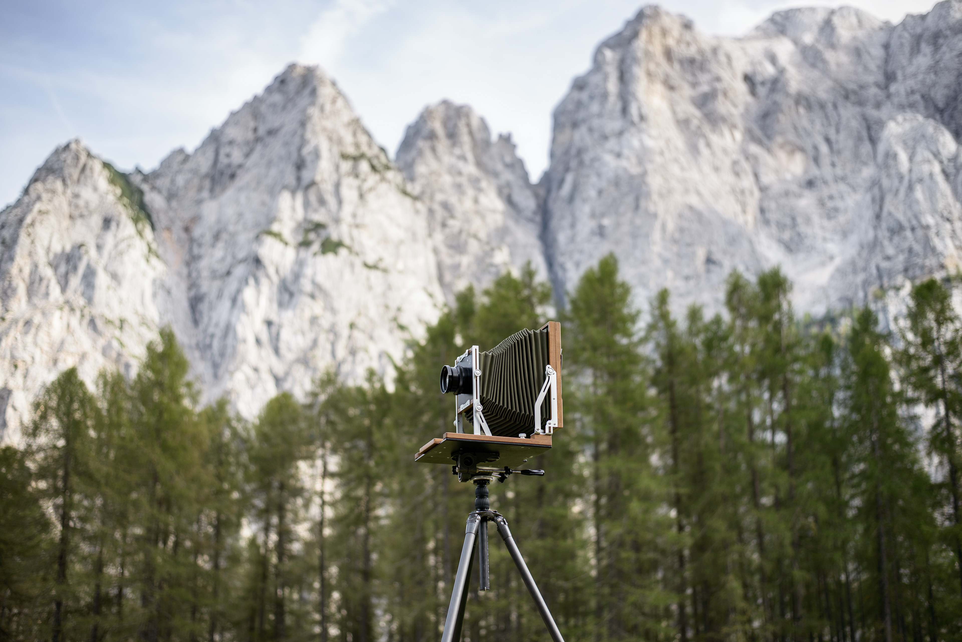“Back in August of 2022 I was fortunate to find myself in Slovenia with my good friend Borut Peterlin. I was not planning on creating on this trip, I had no camera or chemistry. I had a thought of a portrait of Borut laying down on a 1000 year old ground level water well with his first book in his hand and his brass lens. I was going to indeed create on this trip, one plate is all I wanted. That is when Peter offered to lend me his camera for the shot. I immediately said, “where did you get this” and he explained “I made it”, I was blown away by the craftmanship and the quality in my hands. I went on to use his camera to make “Succumbed To Light” on August 6th, 2022. My 4341st wet plate since I began the wet plate process in October of 2012. The camera worked like a dream even in the uncertain environment of the Slovenia mountainside. I would recommend this camera by my good friend to anyone.” Shane Balkowitsch Nostalgic Glass Wet Plate Studio Bismarck, North Dakota, USA