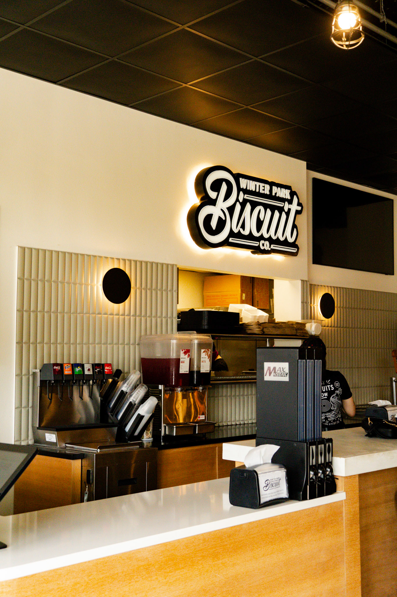 Creative angle to capture the lit up brand name without the messy counter and kitchen.