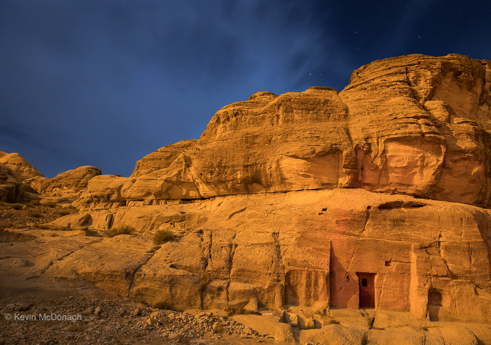 Tomb and hill lit by the moon at Petra