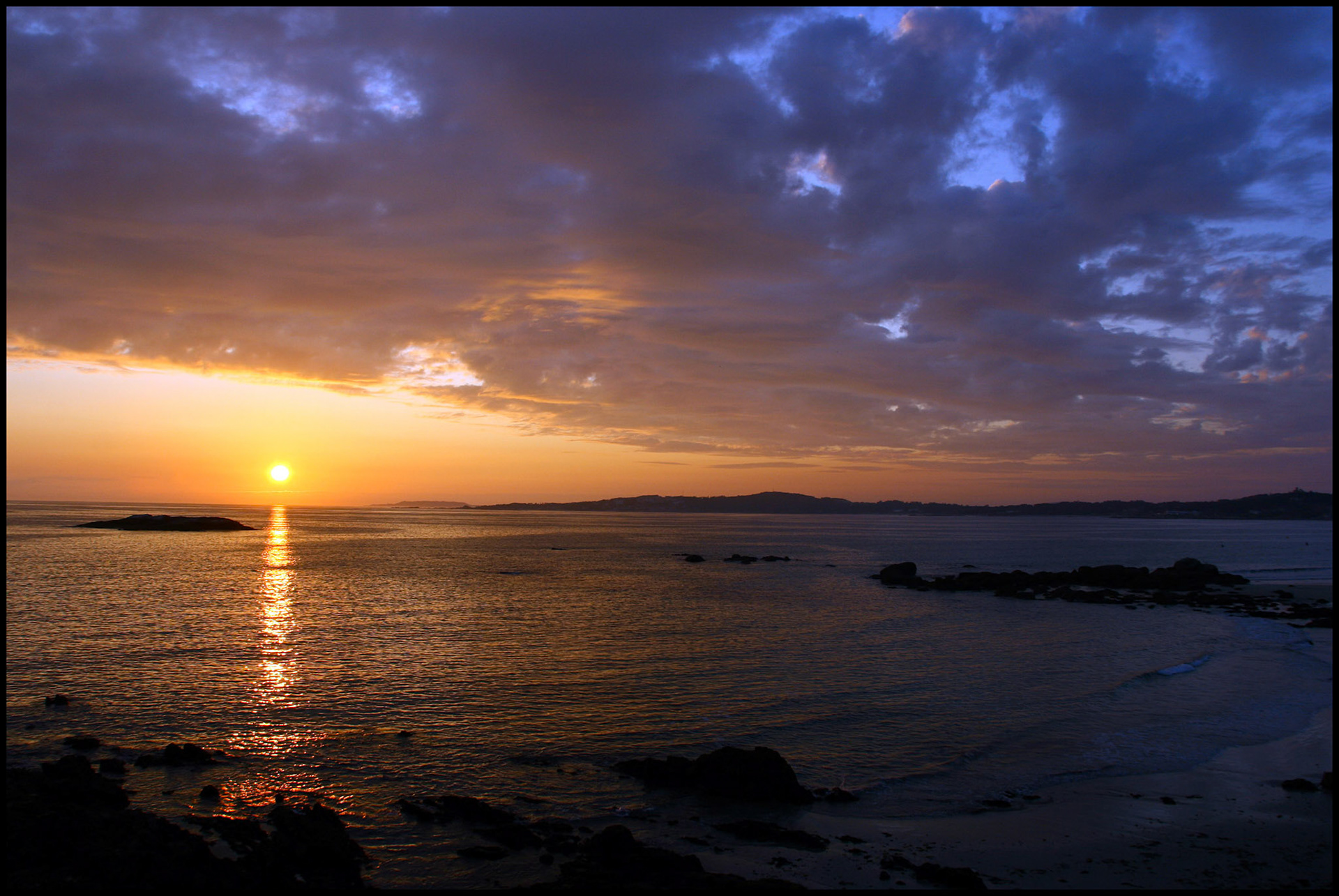 Puesta de sol en la Lanzada. Ampliar