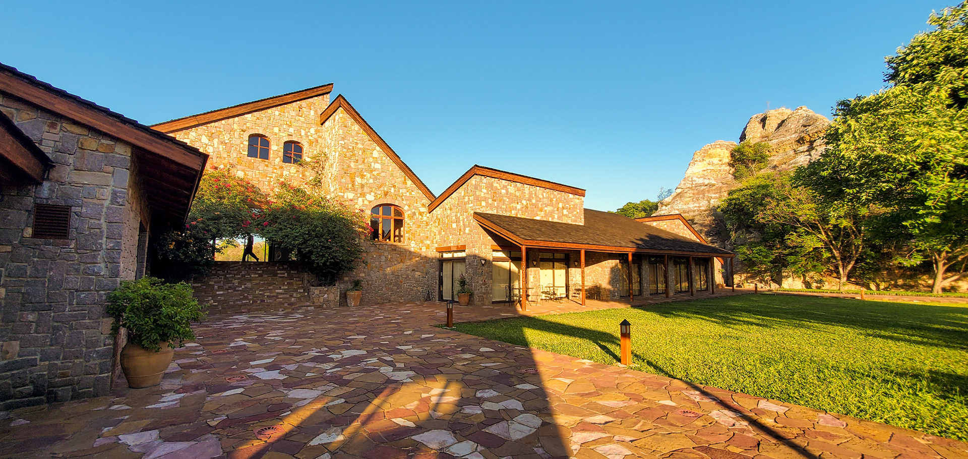 Hotel Le Jardin du Roy. Steep pitched roofs and granite stone walled architecture served to blend and contrast with the environment.