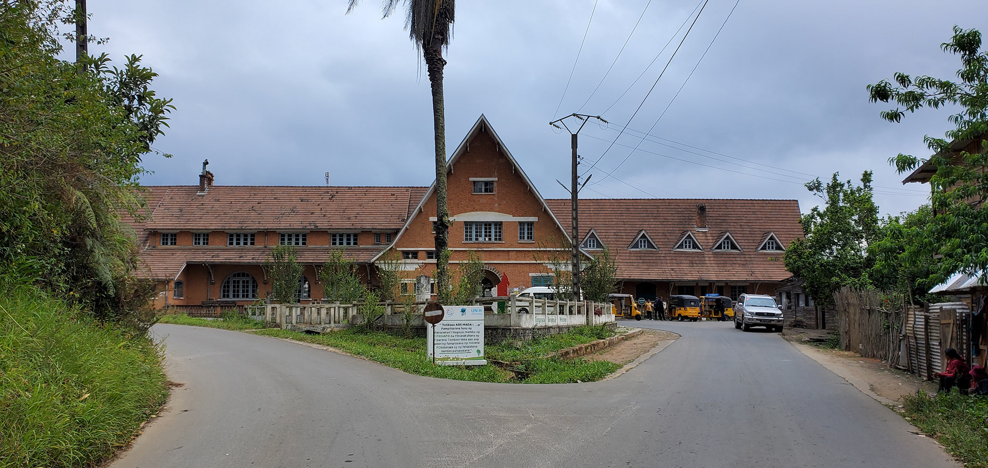 The Andasibe Railway Station was established by the French in the early 1900s near Analamazaotra village that was named after Henri Périnet,  the principal railway engineer on this section. From Périnet station, logging camps along the  railway were established for railway construction. The biggest logging camp was established  close to Périnet station itself and simply called Andasibe (= at the big camp). Until today, the  names Analamazaotra, Périnet and Andasibe are used interchangeably. The rail network and associated villages served as a network to expedite the exploitation of timber and depletion of forest resources. The introduction of both  pine and eucalyptus dates back to the 1910s and in some areas of Analamazaotra these trees are  still prevalent.