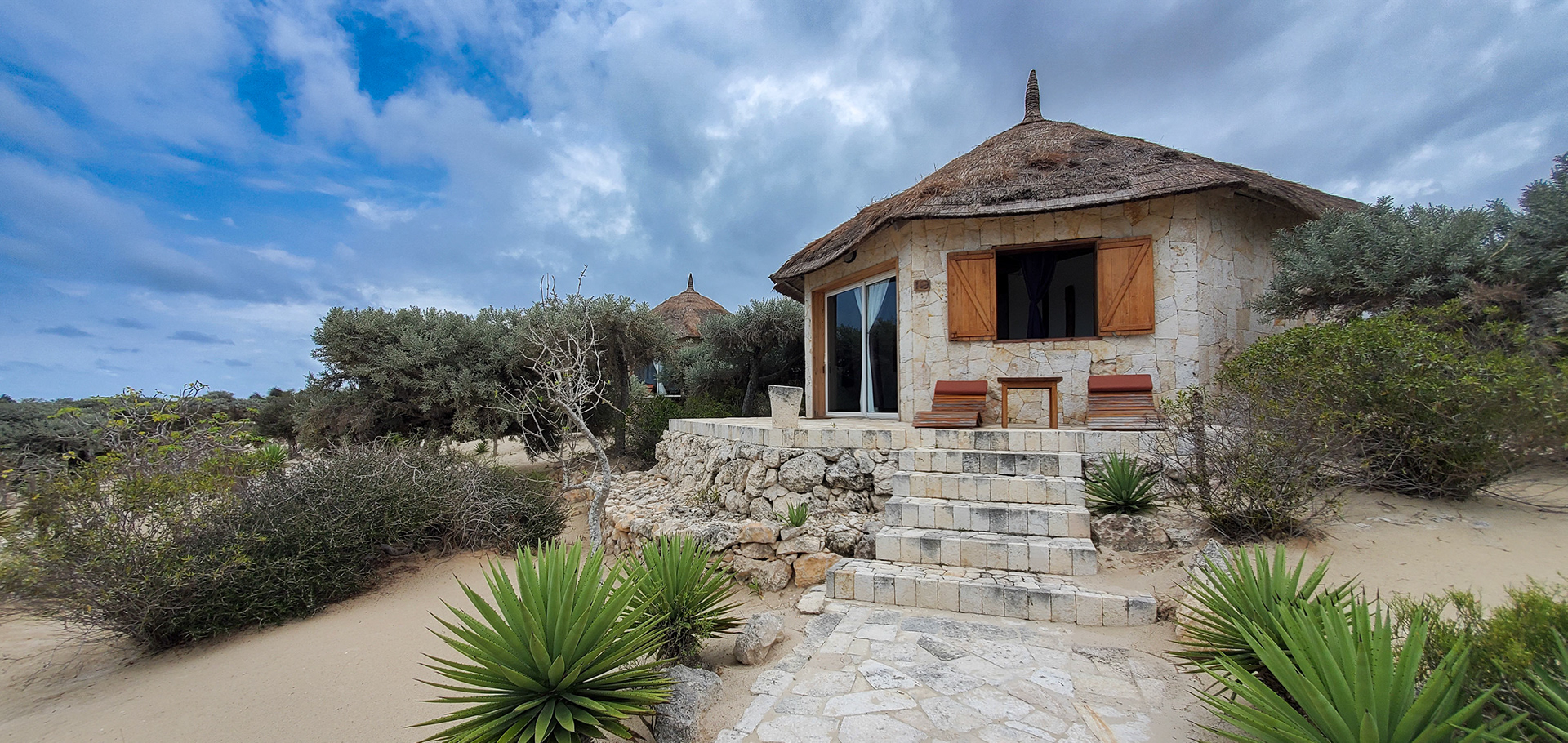 The paths and bungalows blended in with the sandy beaches.  
