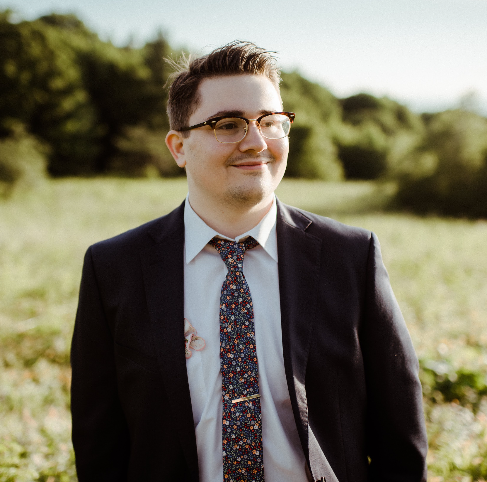 A professional portrait of guitarist Isaac Brady.