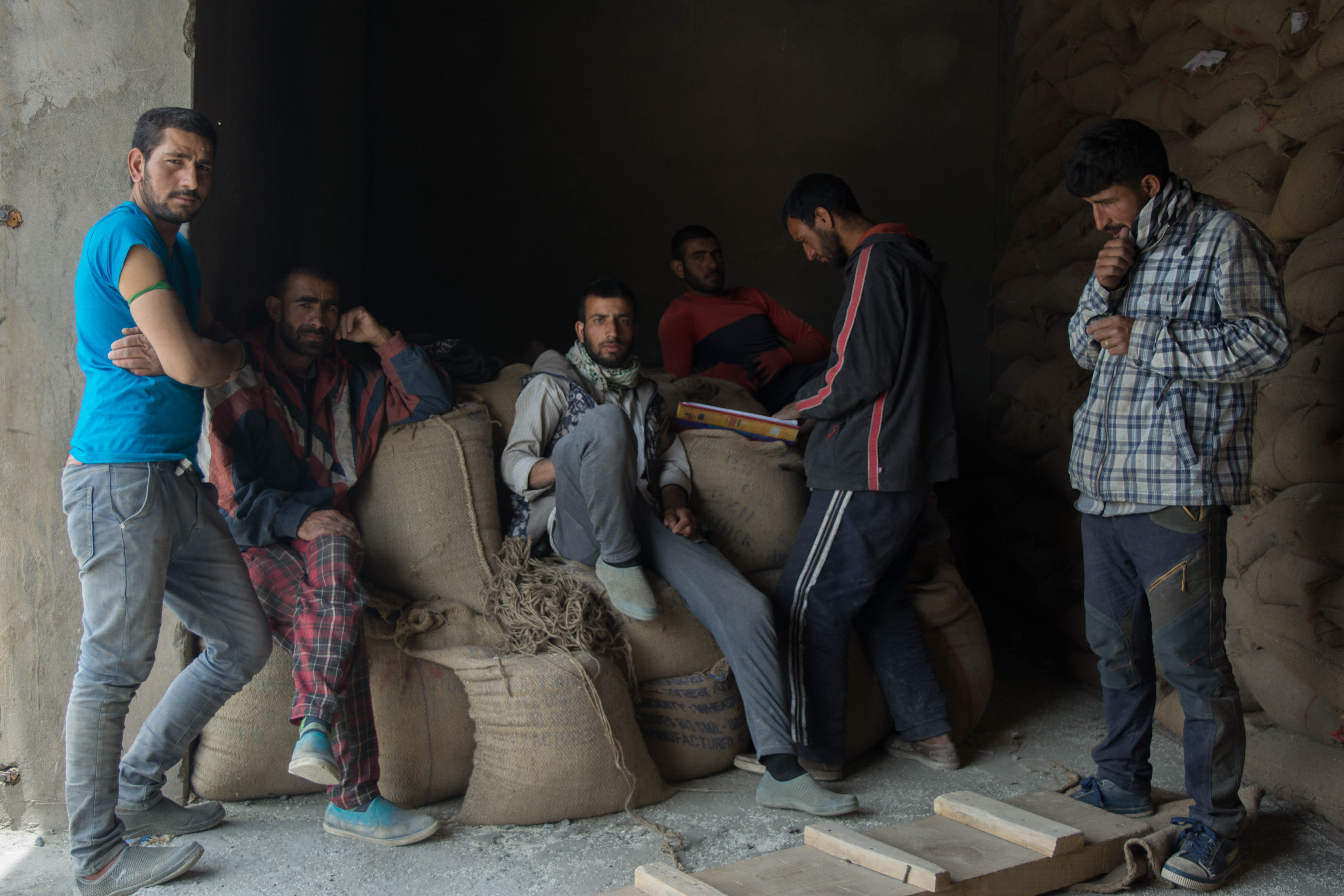 Workers wait to load and unload the Trucks