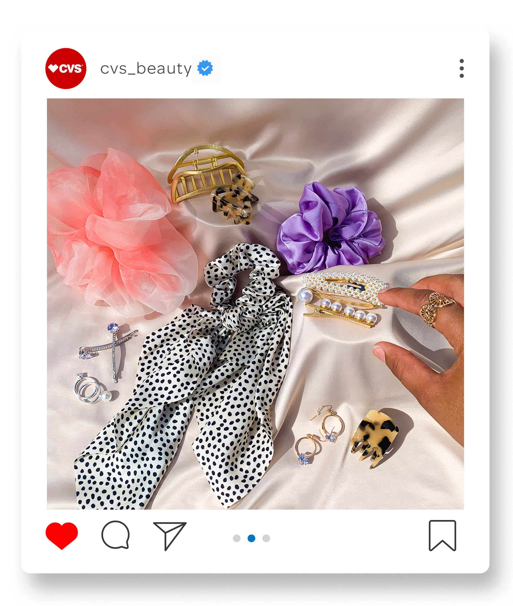 With hair accessories making a comeback, it's time to let followers know that CVS® has a variety of options. This post captures a person adding the finishing touches to their outfit; choosing accessories. The photograph feels fabulous, vibrant, and effortlessly chic.