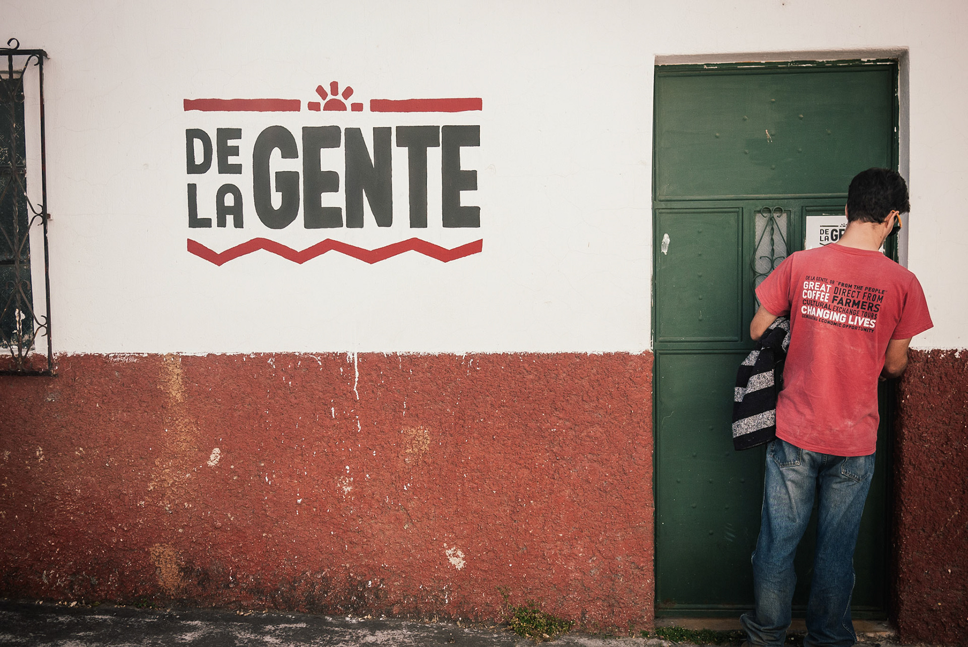 Our British, drug-eyed translator, letting us into the De La Gente "corporate headquarters".