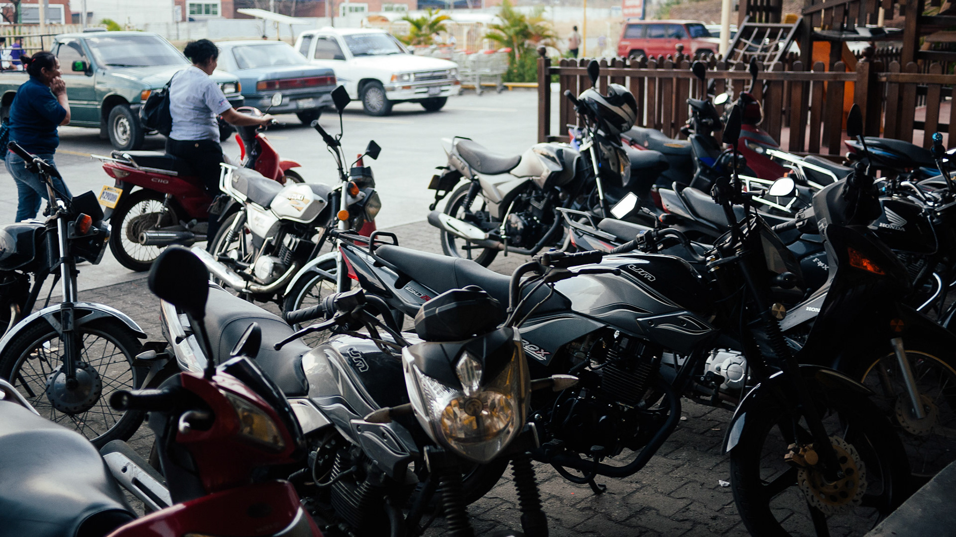 Even at the grocery store the most common vehicle was the motorcycle.