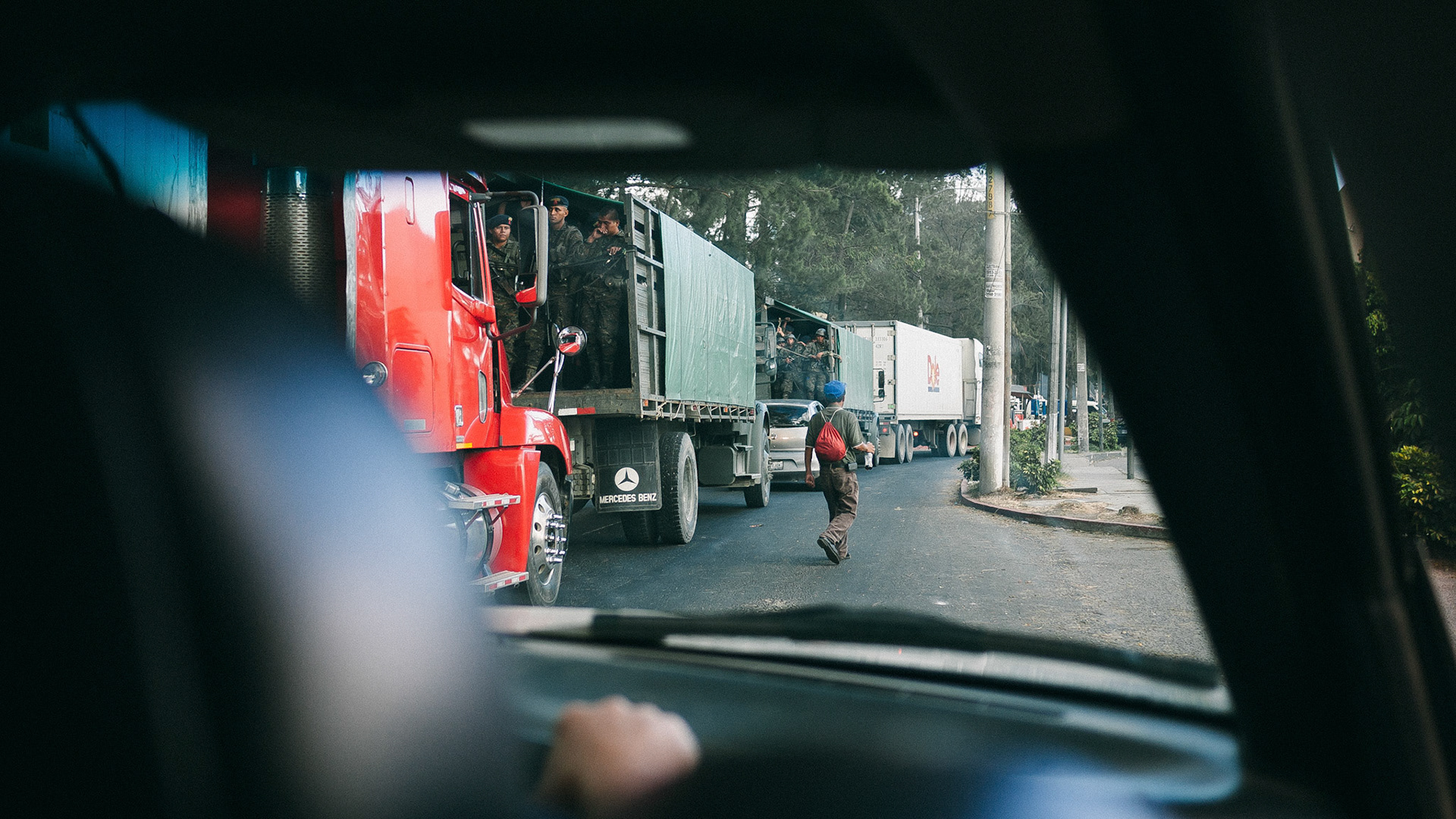 A truck of armed soldiers making its way through Guatemala City