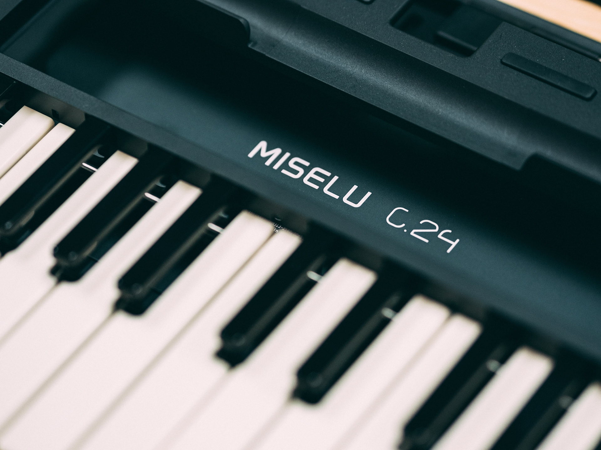 Bluetooth iPad keyboard with electromagnetic keys and optical sensors.