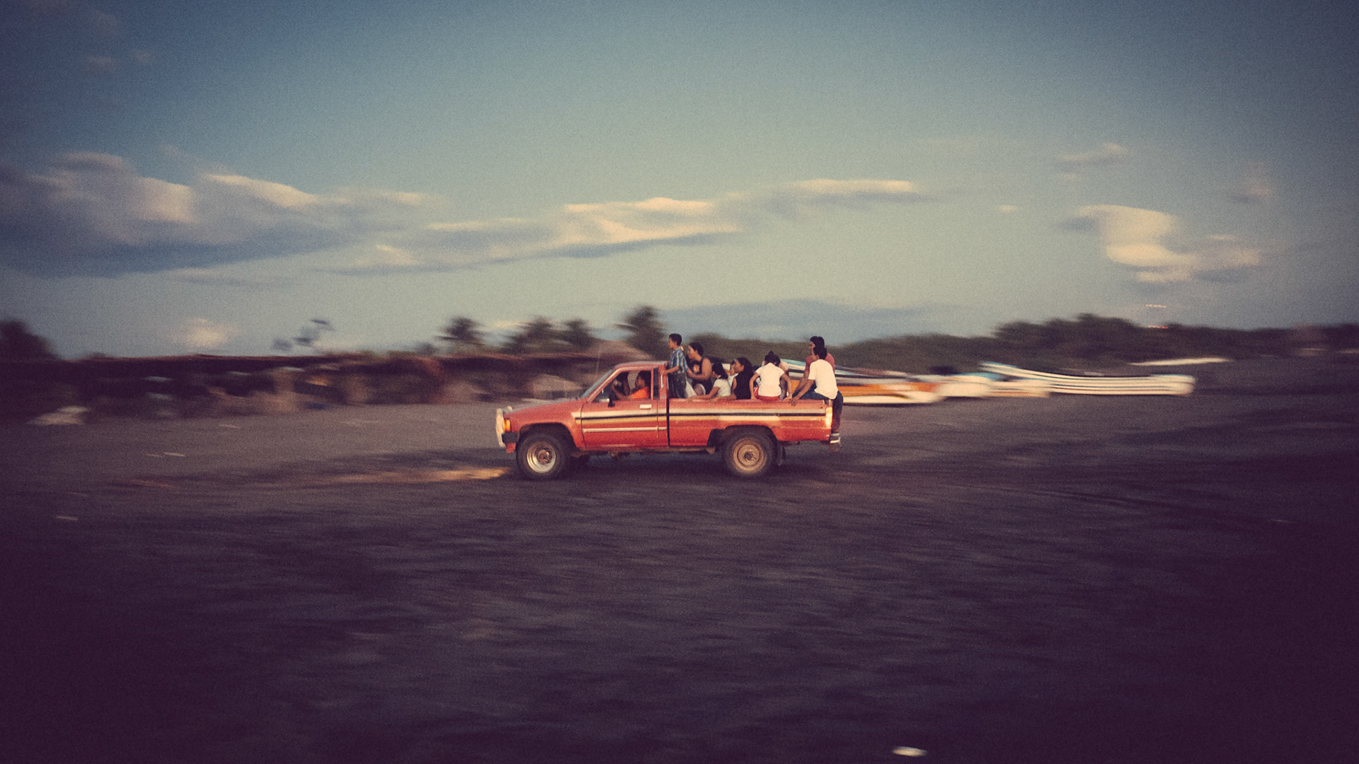 This truck full of Guatemalans appeared on the beach from nowhere and promptly got stuck in the sand. This photo is their second attempt to get off the beach, going much faster this time.