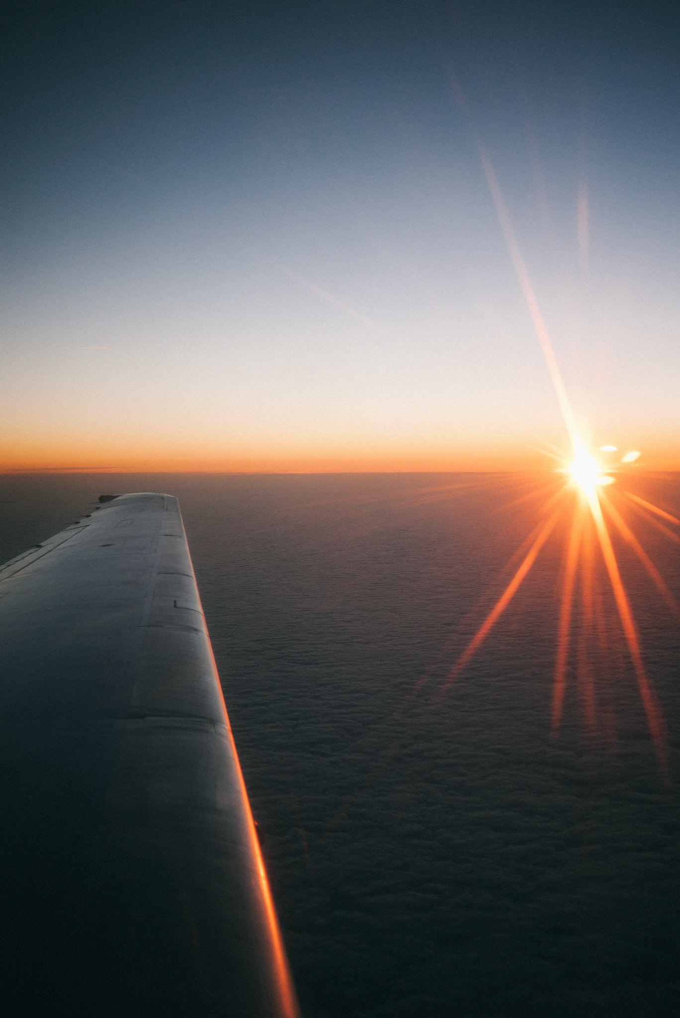 One advantage of our early morning flight was the breathtaking sunrise over the cloud line.