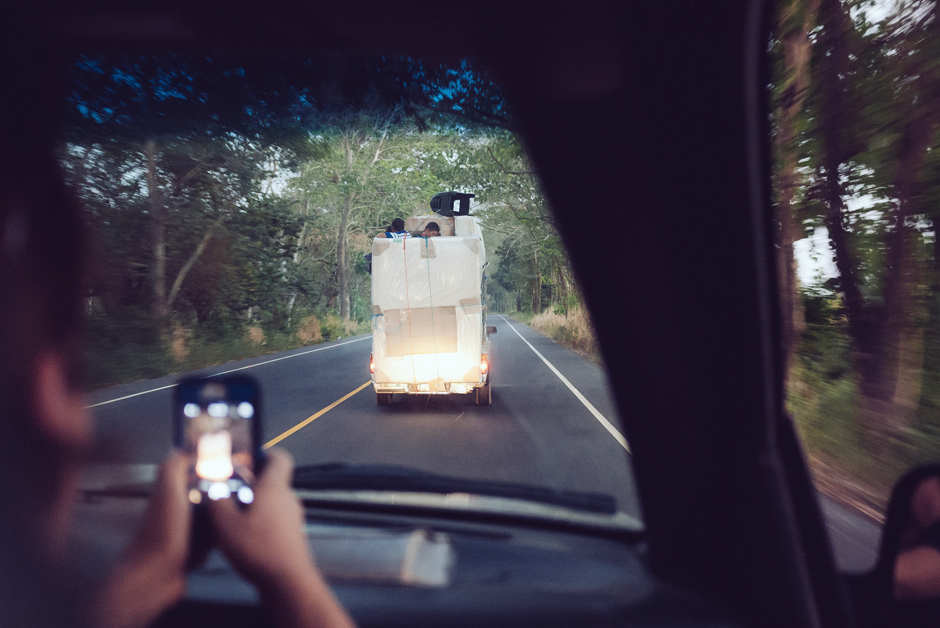 It was not uncommon to see a couple little heads poking out from atop a towering load of cargo on a tiny pickup.