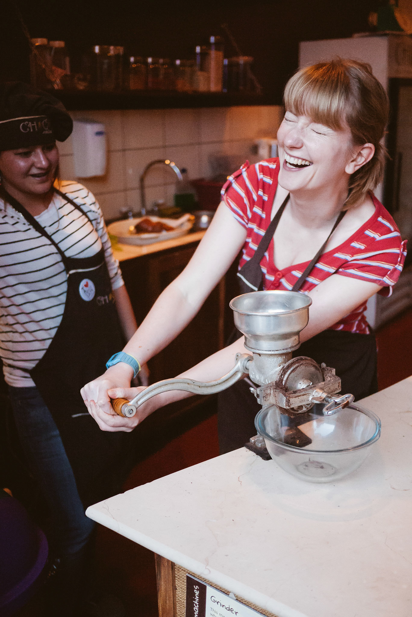 This British lady's adorable attempt at grinding cacao.