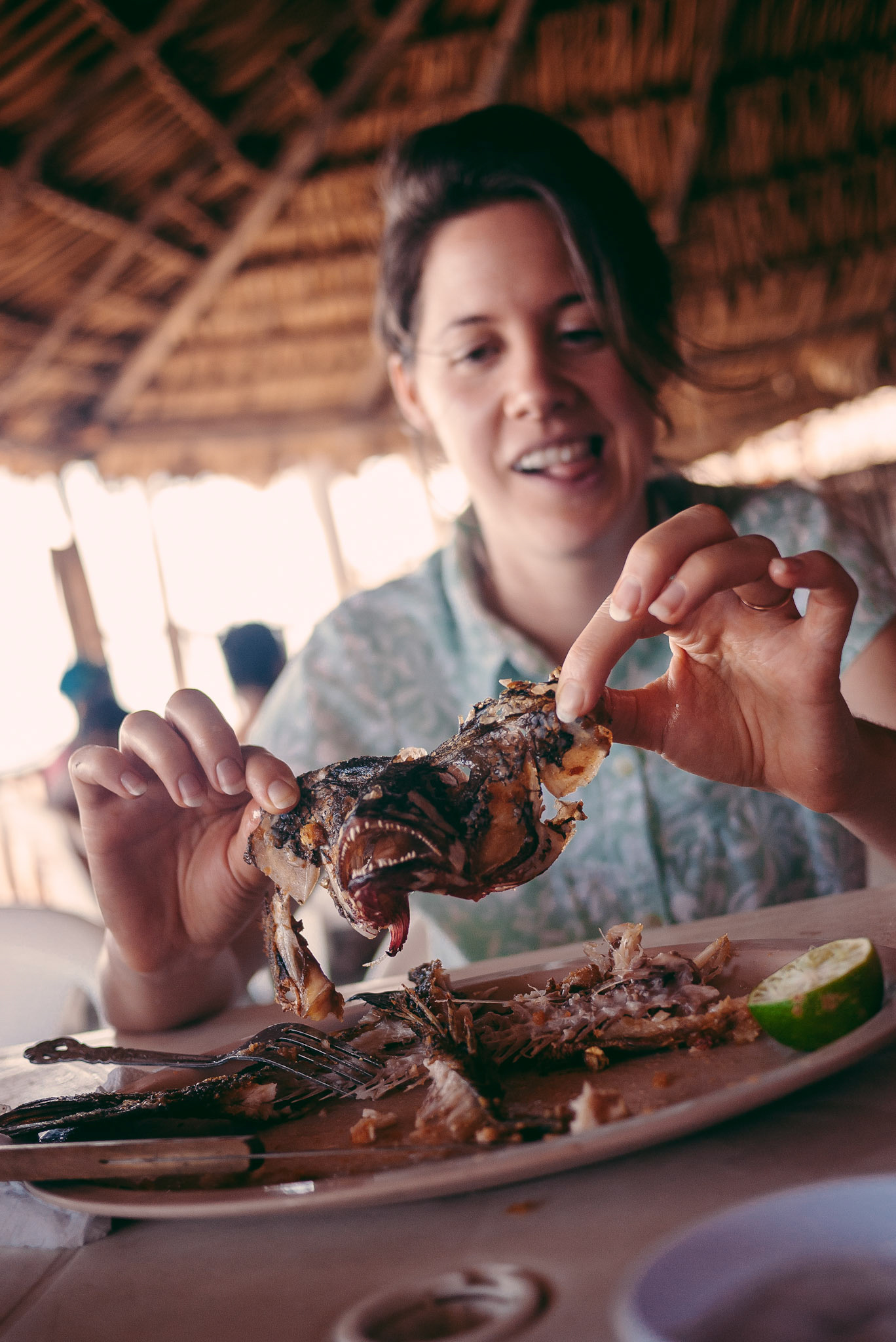 Kristy's mom never told her not to play with her food, or in this case, the remains of her food's face.