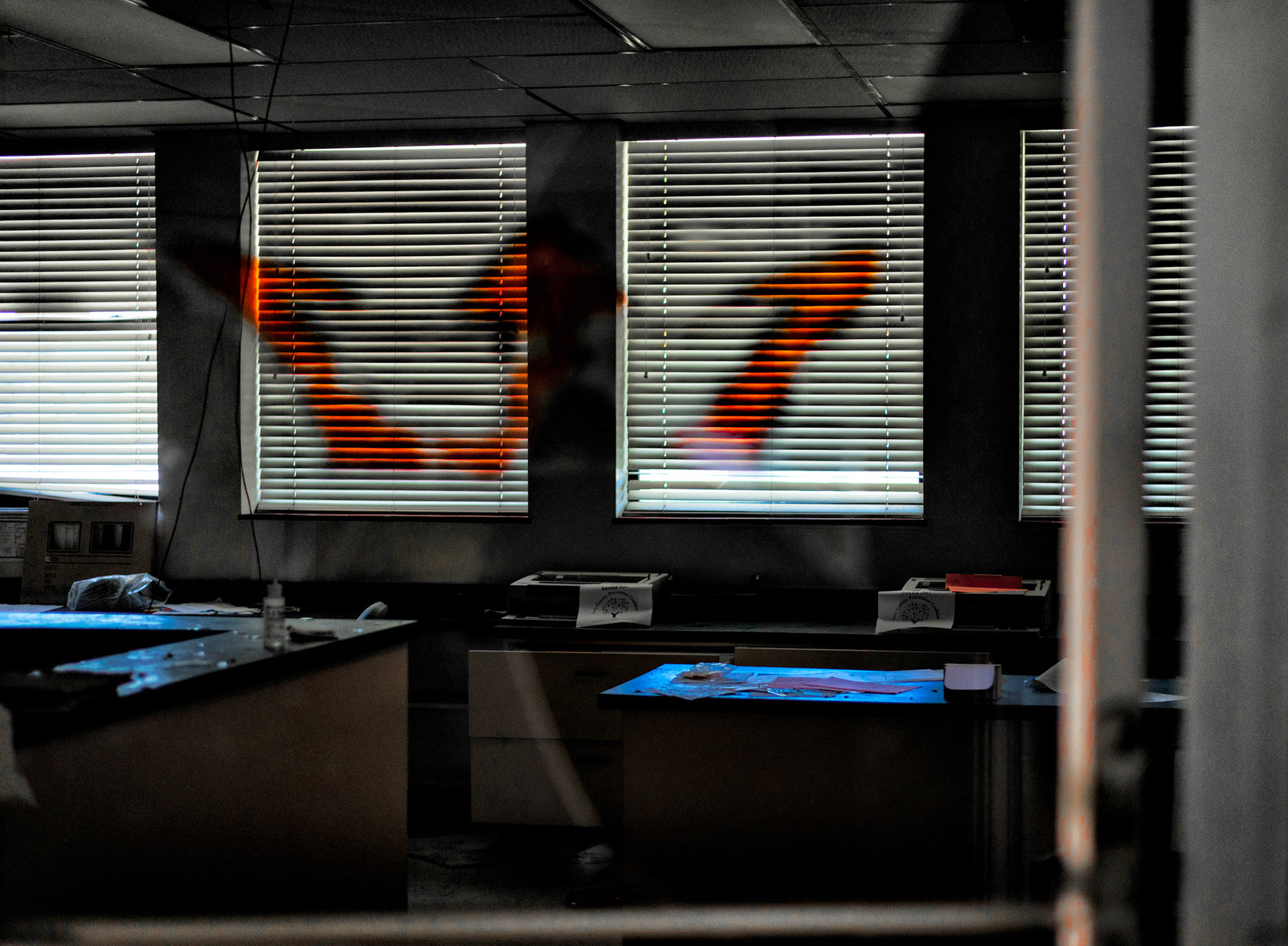 Taken through vandalized glass and graffiti