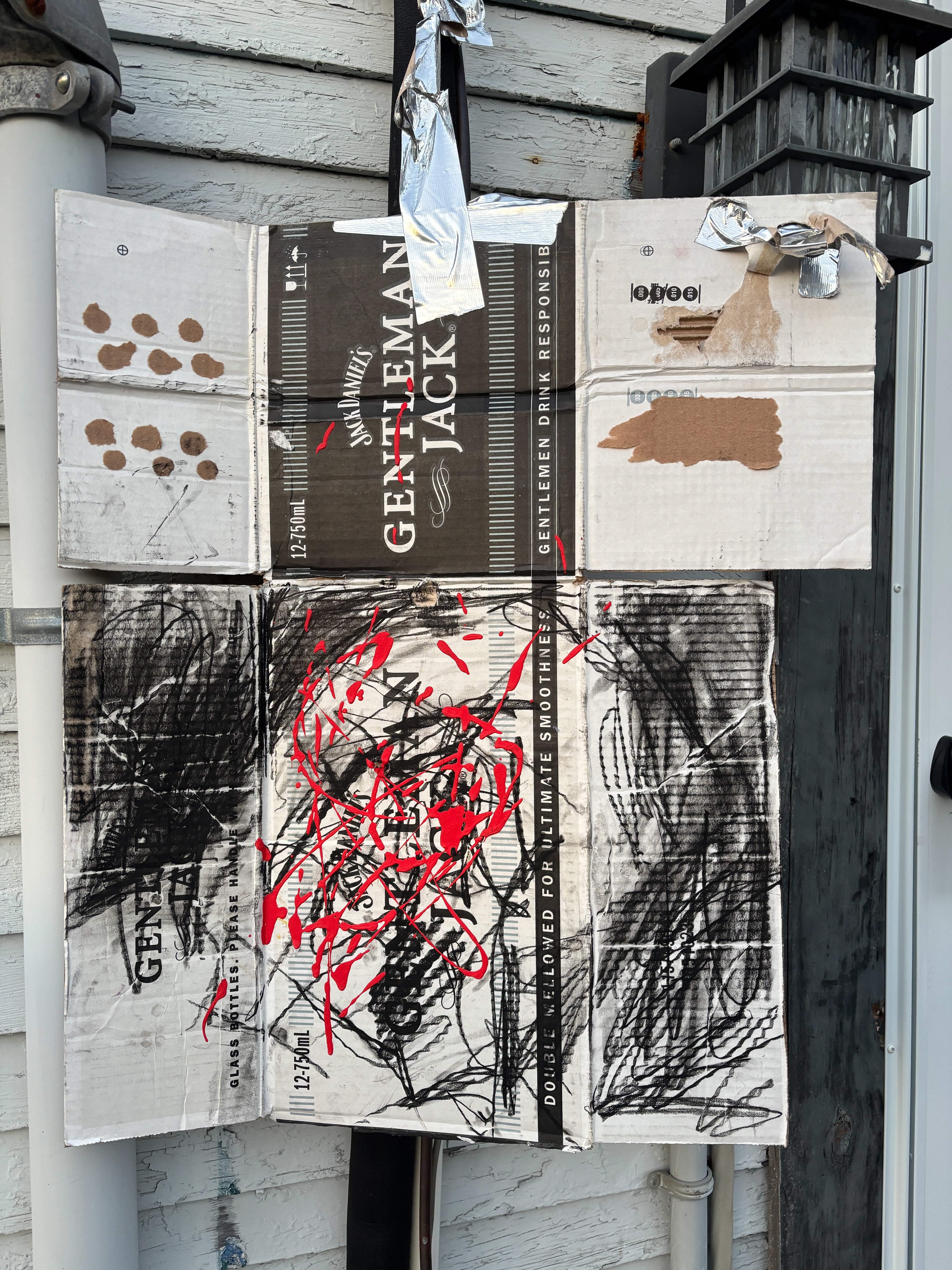 Charcoal and handmade paint on cardboard