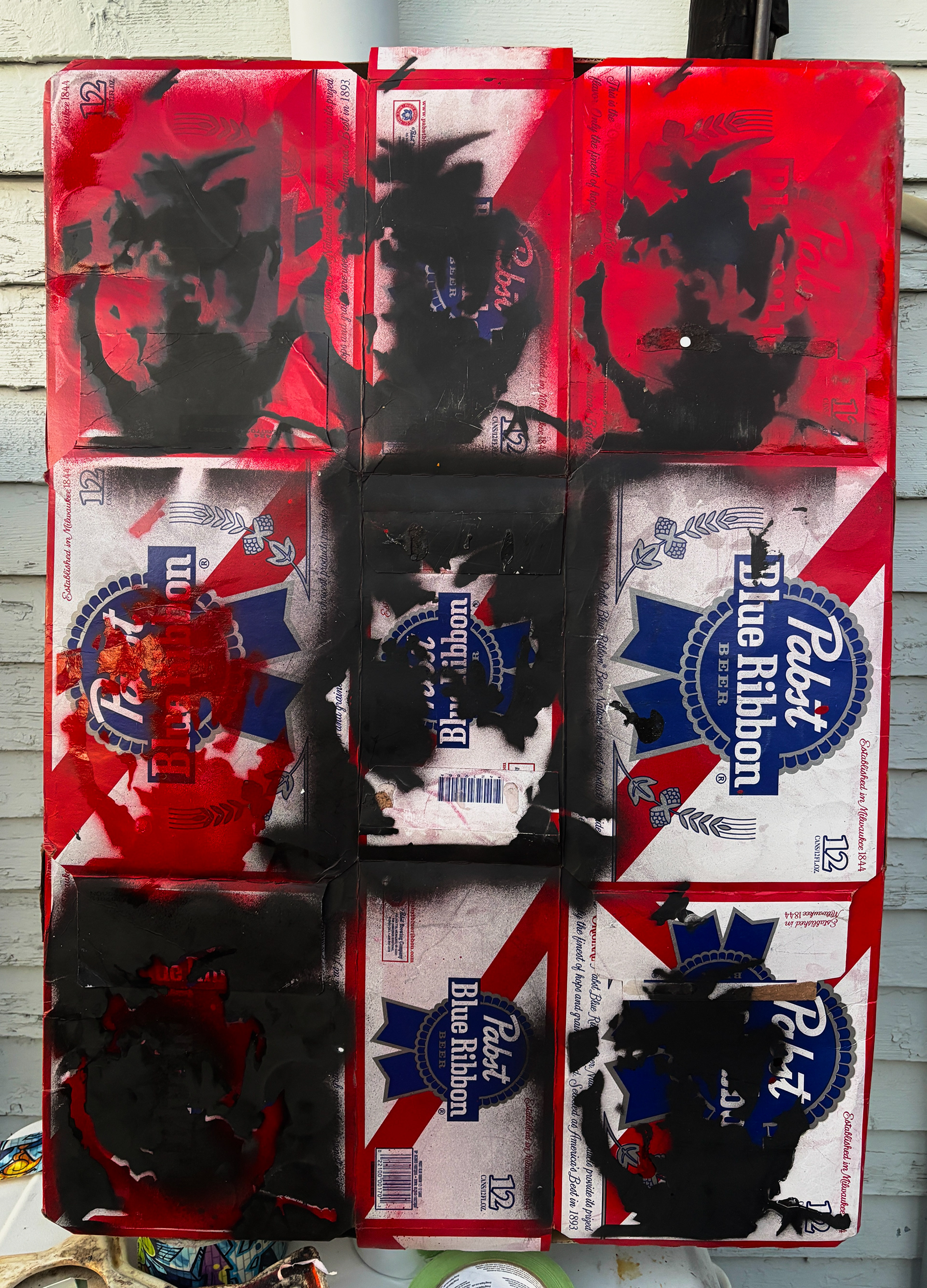 Spray paint on cardboard