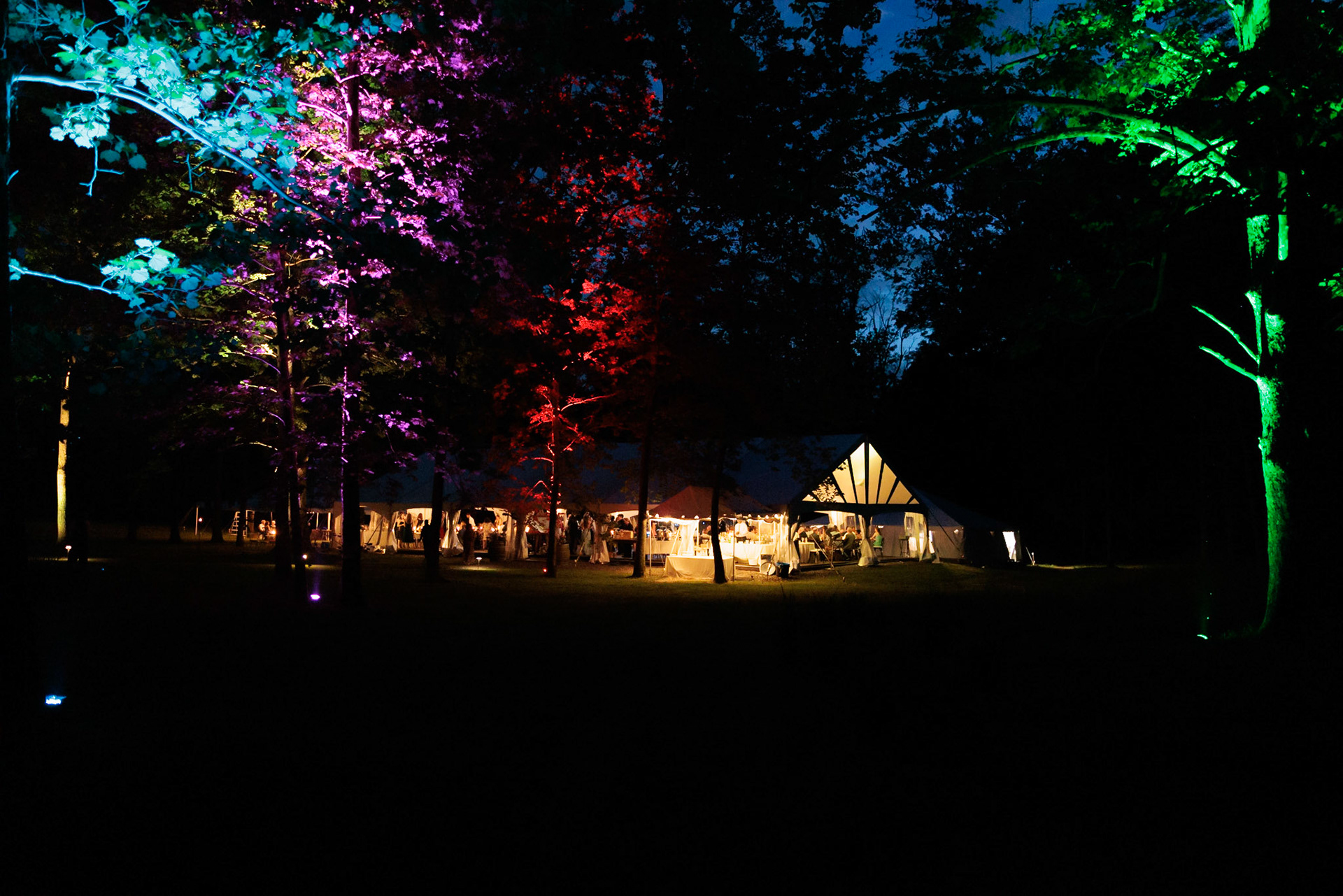 Night view of tent from adjacent fields