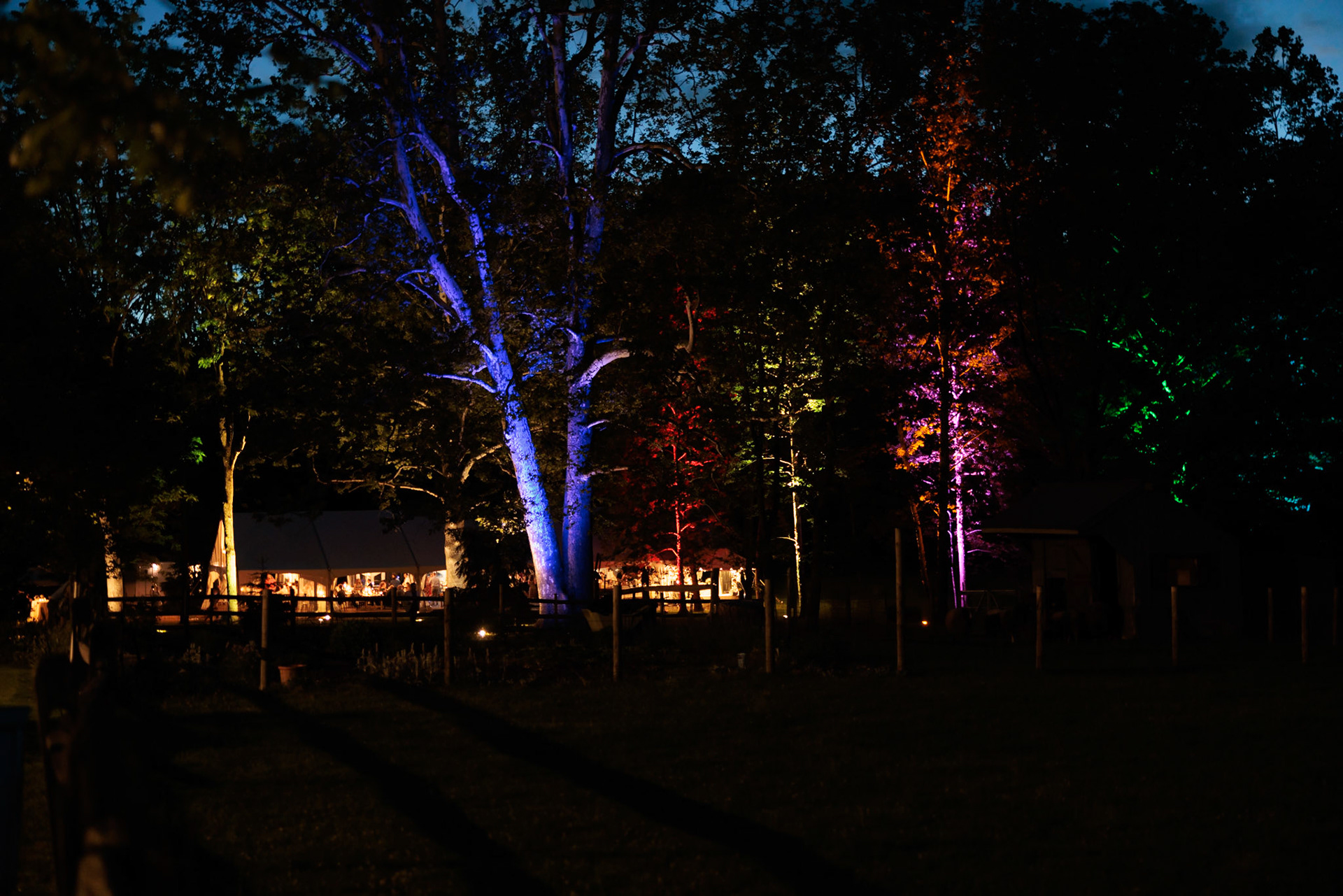 tent from distance with colored trees