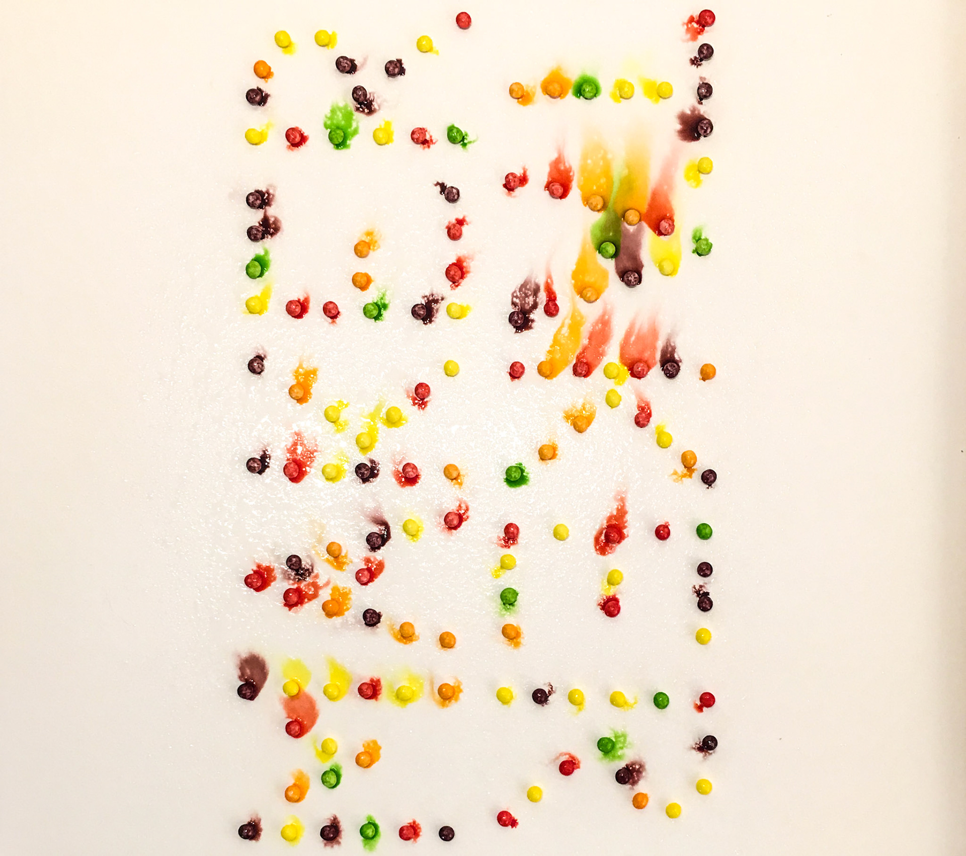 Makertaker II, 2019. Skittles-dyed paper on cotton rag paper mounted to wood panel.
