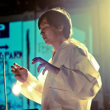 Ng Chor Guan, the co-founder of Toccata Studio, renowned Malaysian composer, sound designer, active thereminist, improviser, educator, and cyclist. A familiar face in many international arts festivals across the continents, Guan is a prolific artist whose diverse body of work is rooted in the contemporaneous currents of technology and yet proves to transcend categories in the performing arts. The arts collective Toccata Studio is his dedication to creating collaborative and multidisciplinary works: they are responsible for a new, progressive wave of contemporary arts in Malaysia that aims to reach and cross global boundaries of culture and tradition.