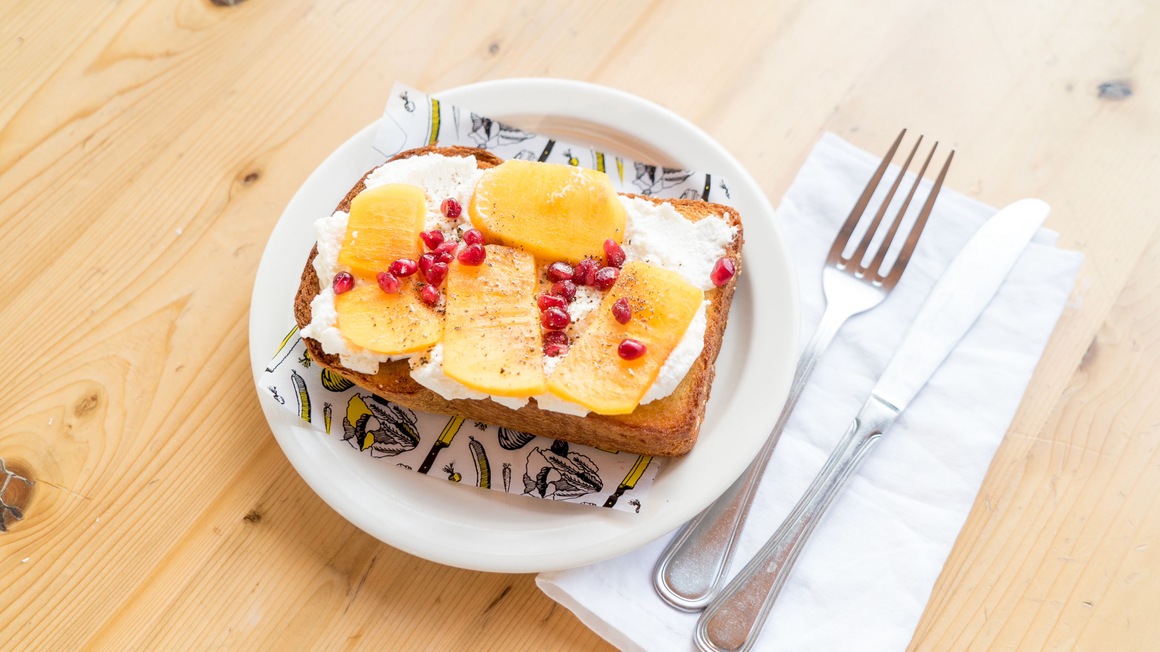 Snack time with a ricotta and fruit toast.